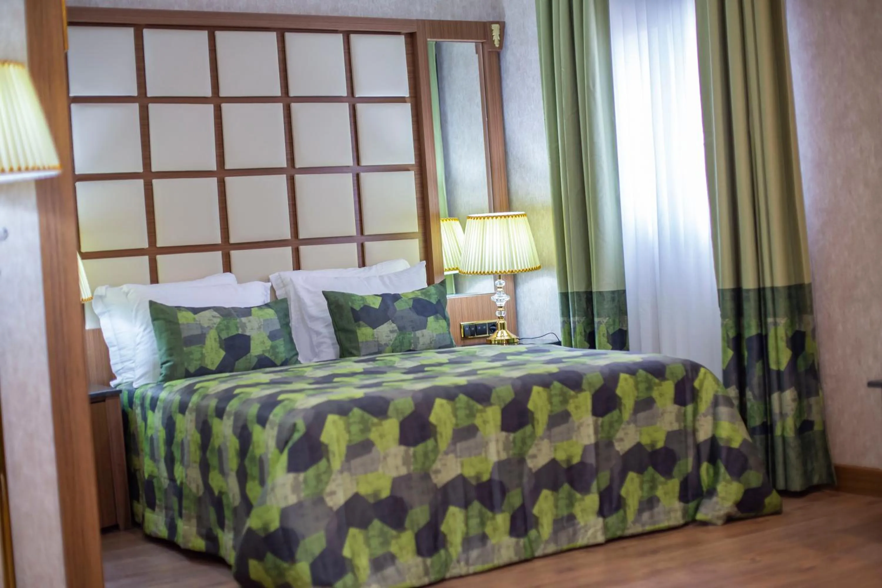 Bed in UNITED HOTEL INTERNATIONAL