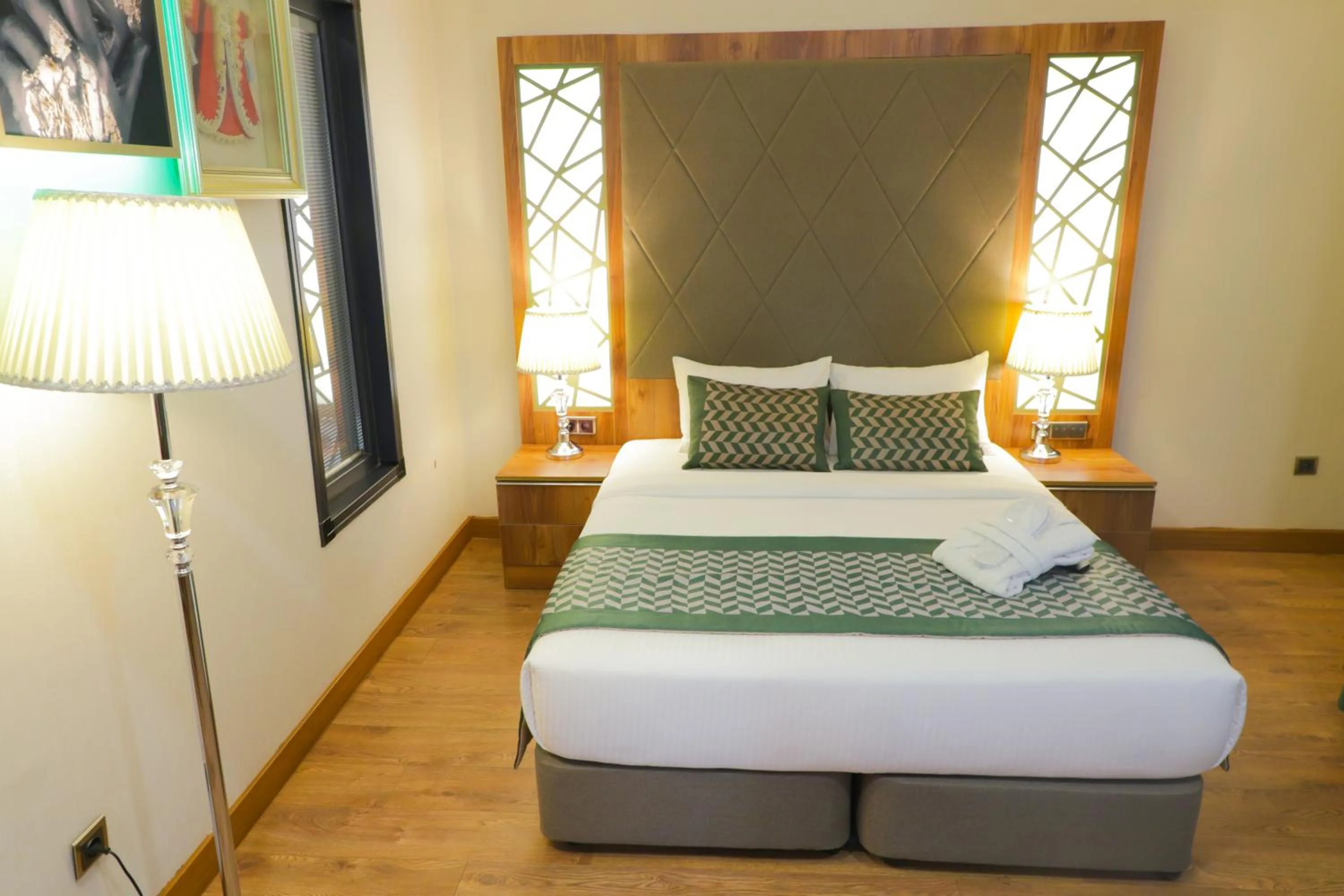 Bed in UNITED HOTEL INTERNATIONAL