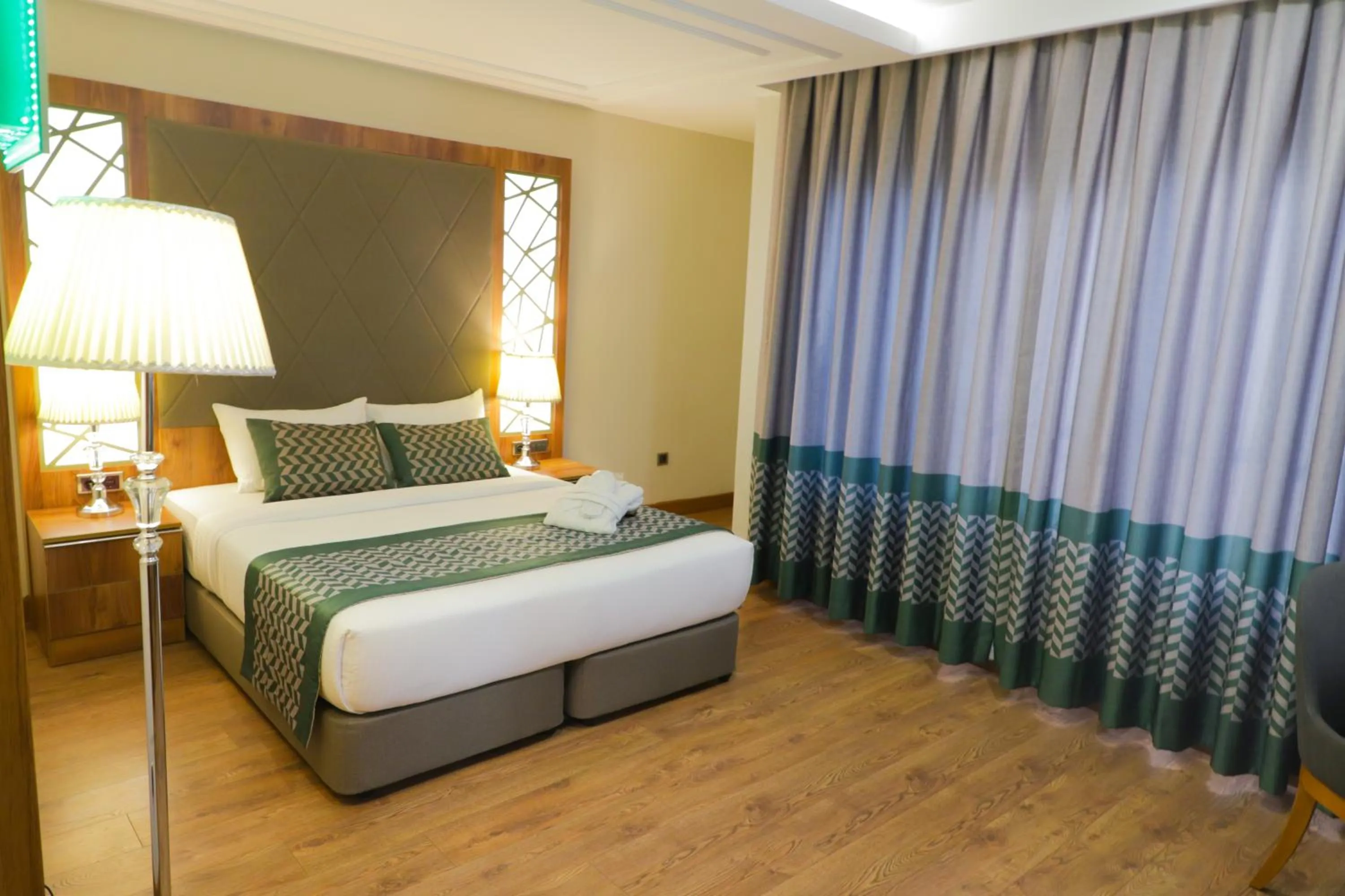 Bed in UNITED HOTEL INTERNATIONAL