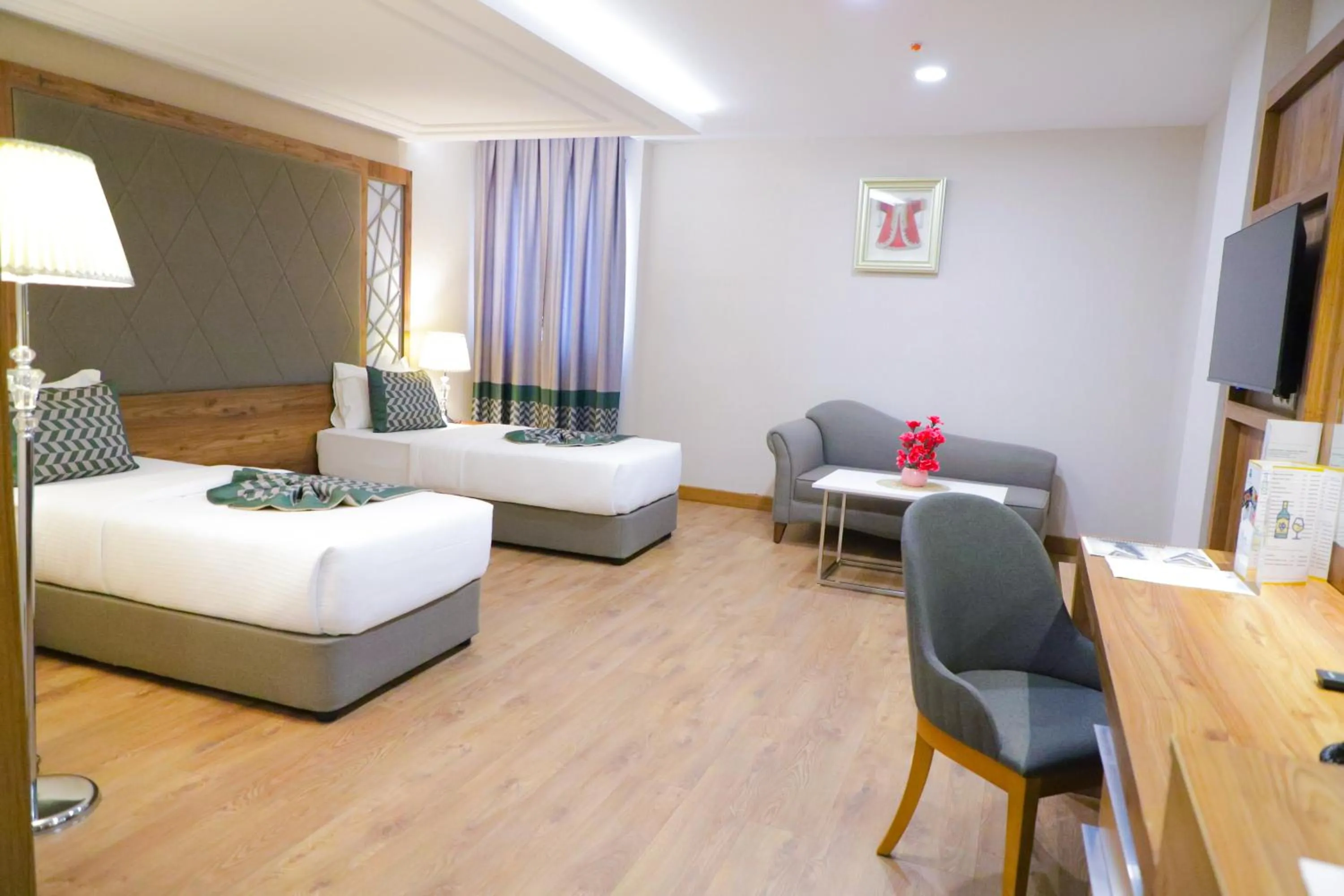 Bed in UNITED HOTEL INTERNATIONAL