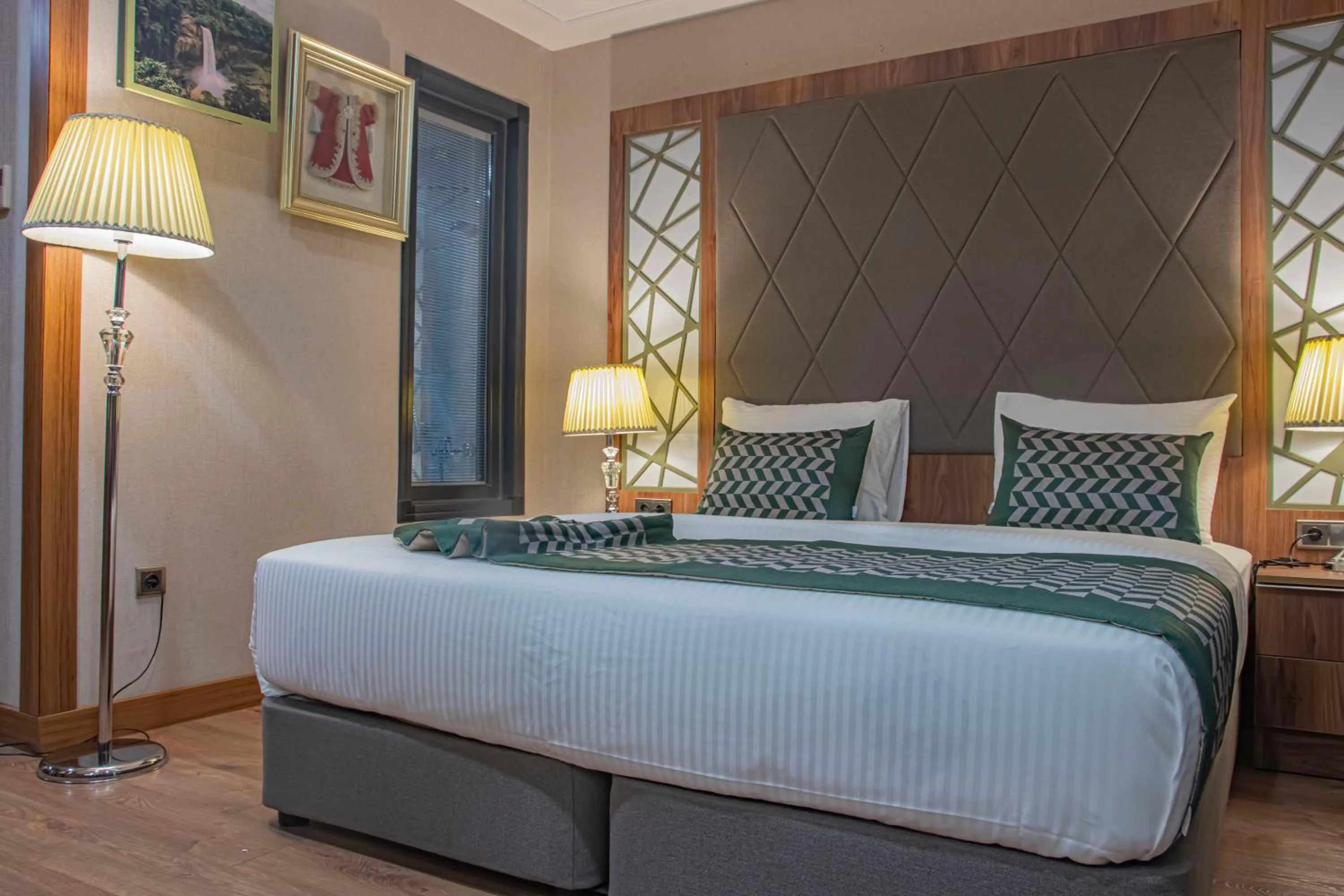 Bed in UNITED HOTEL INTERNATIONAL