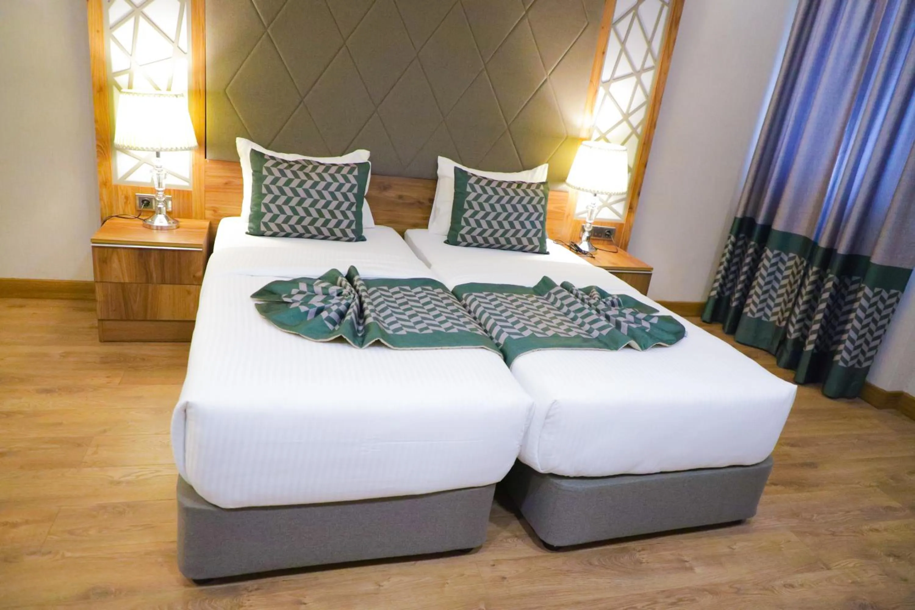 Bed in UNITED HOTEL INTERNATIONAL