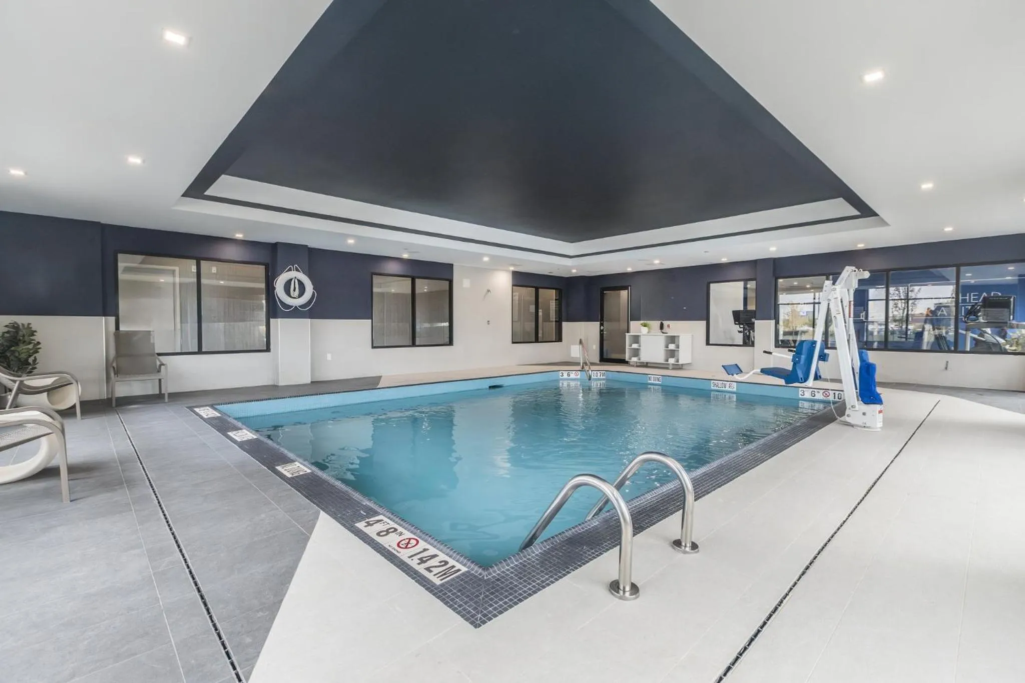 Swimming pool in Holiday Inn Express & Suites Toronto Airport South by IHG