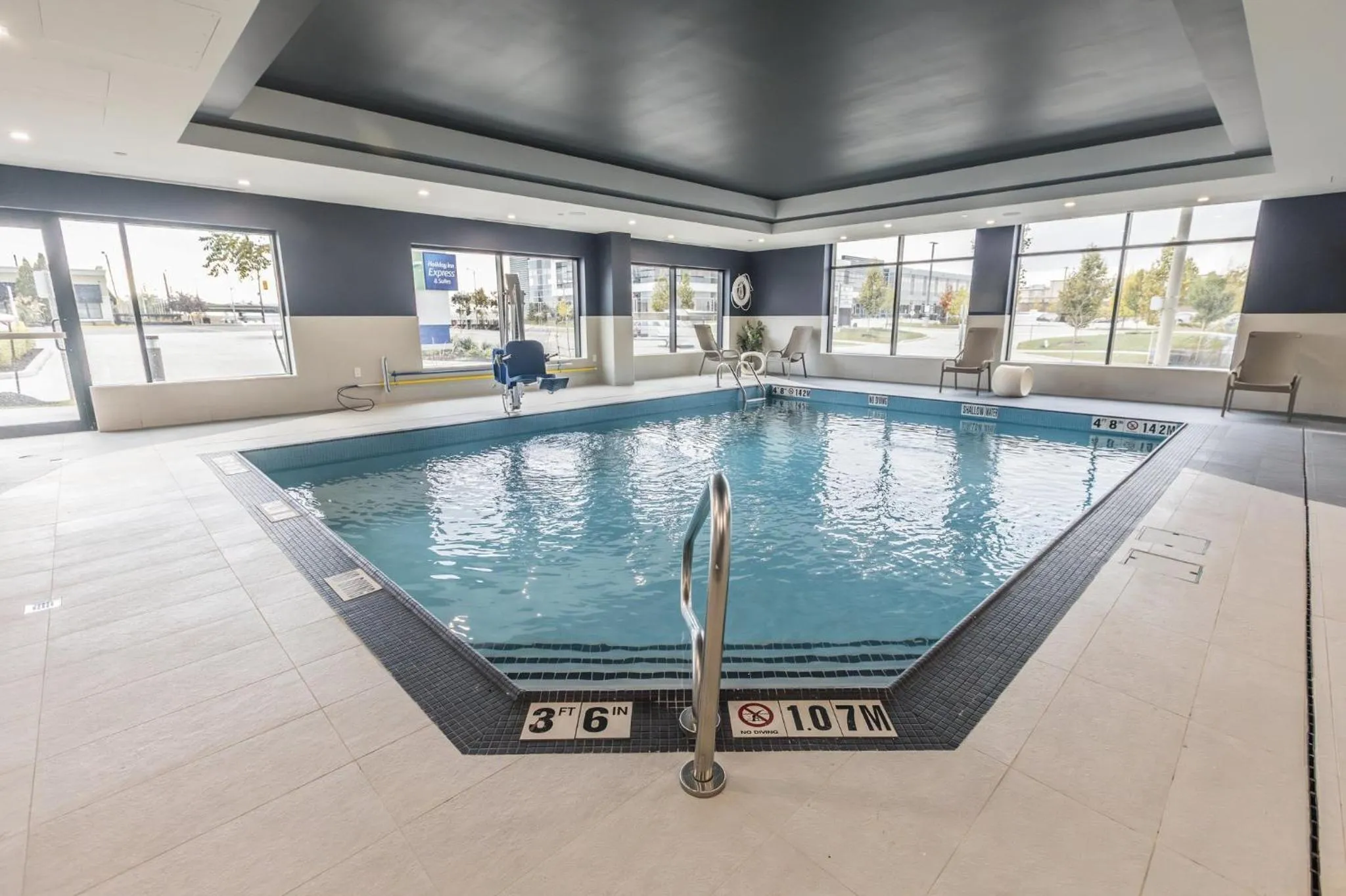 Swimming pool in Holiday Inn Express & Suites Toronto Airport South by IHG