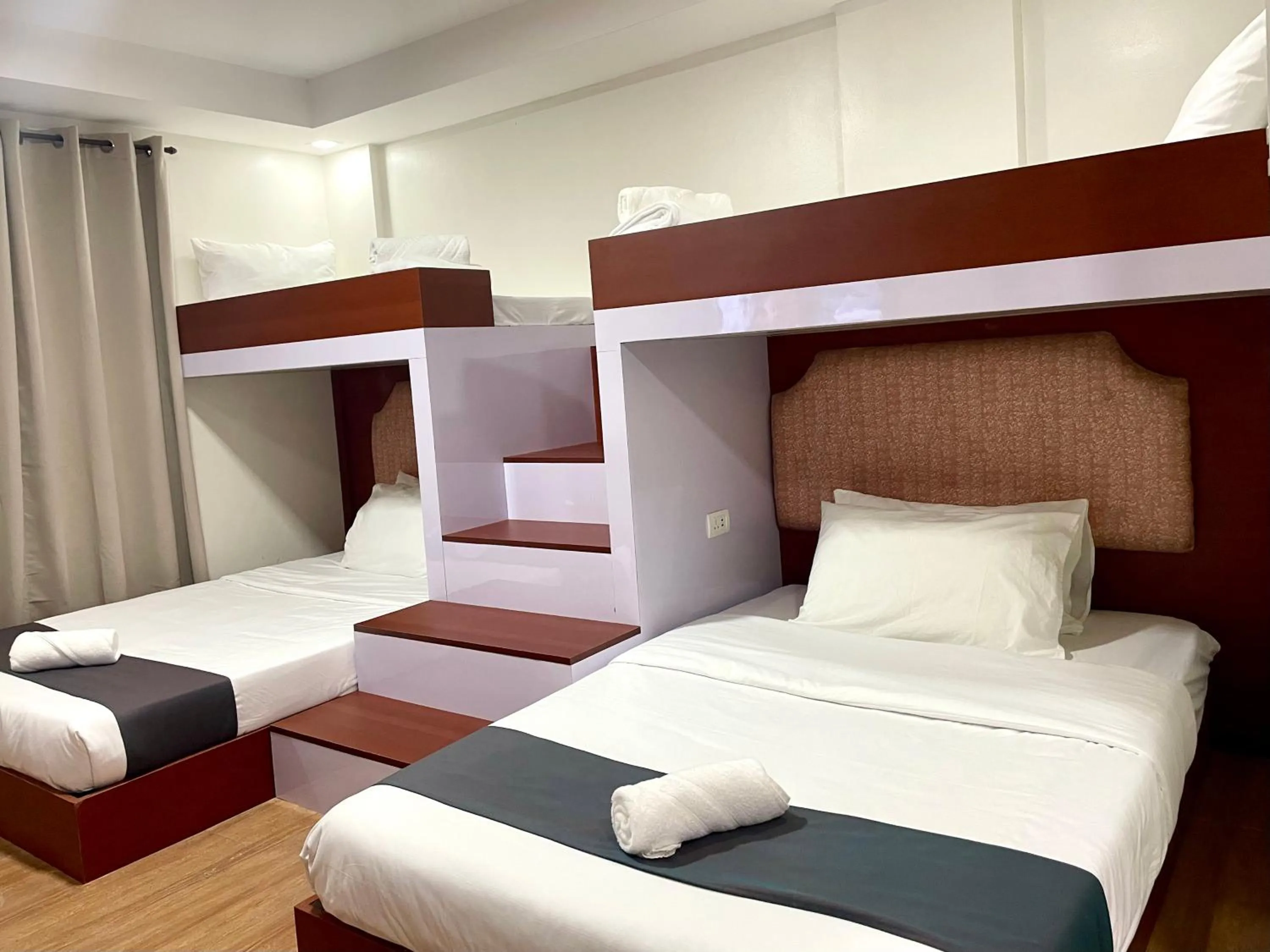 Bed in Staycation Hotel