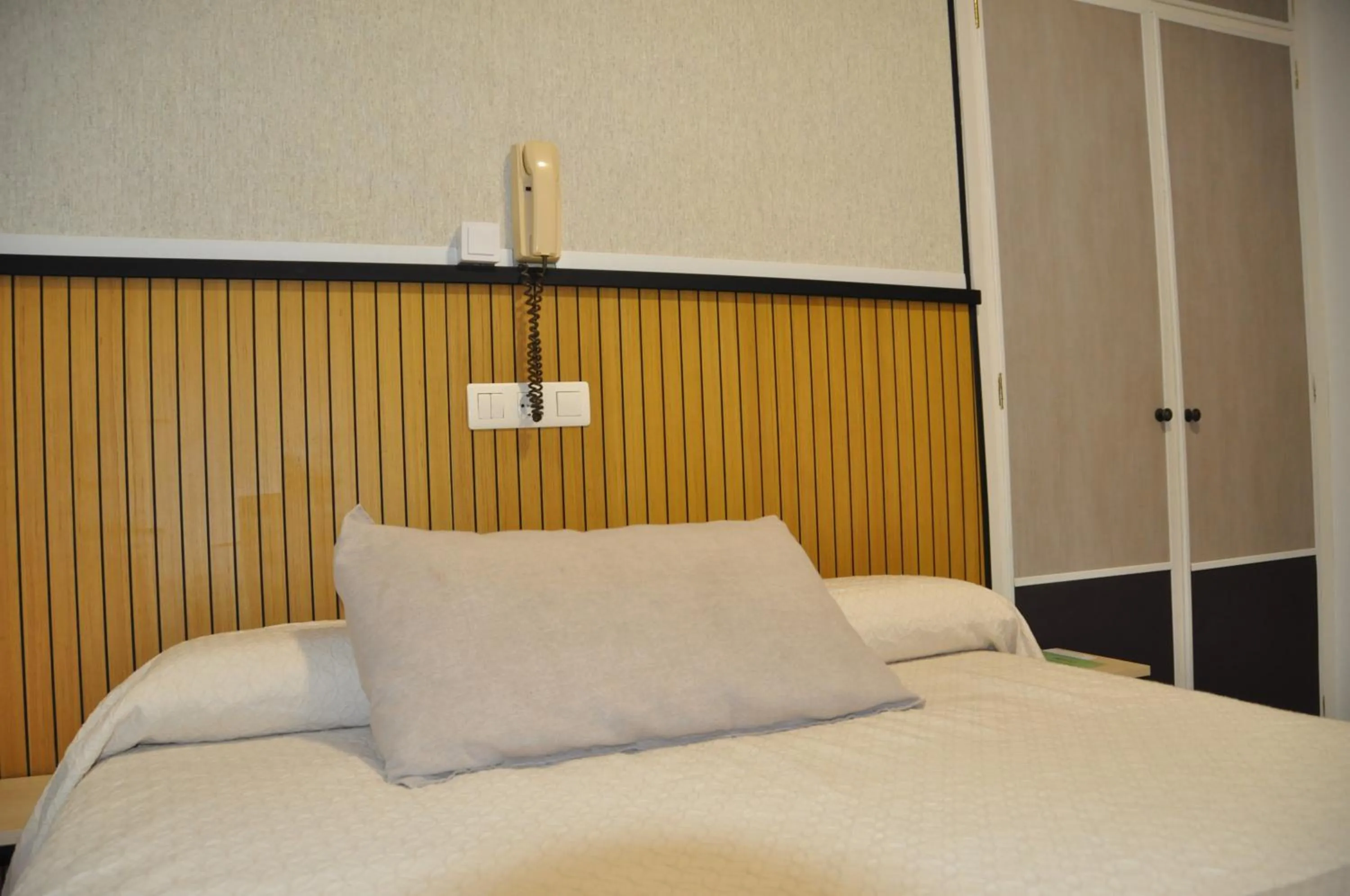 Bed in Hostal Ramón y Cajal