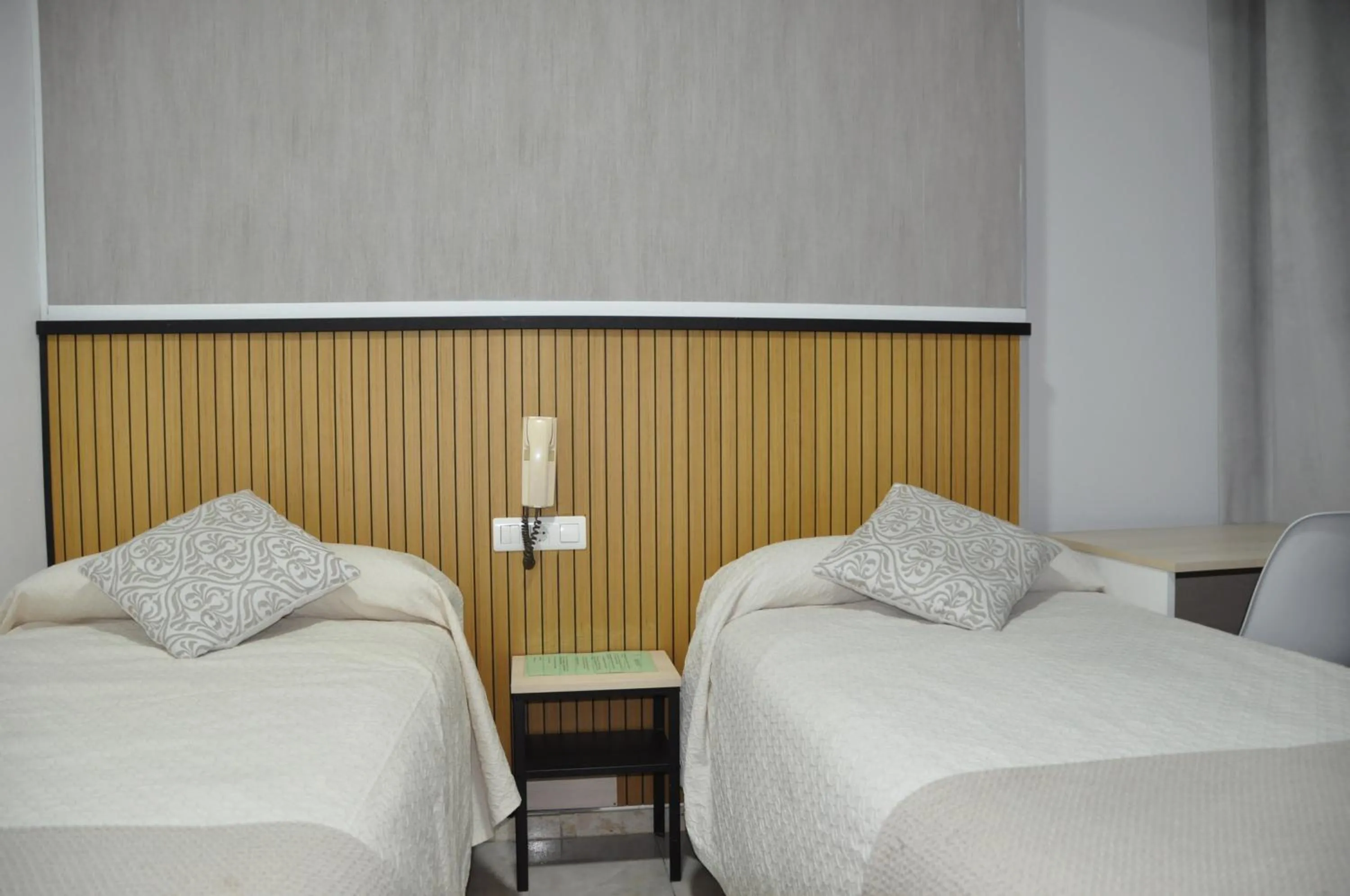 Bed in Hostal Ramón y Cajal