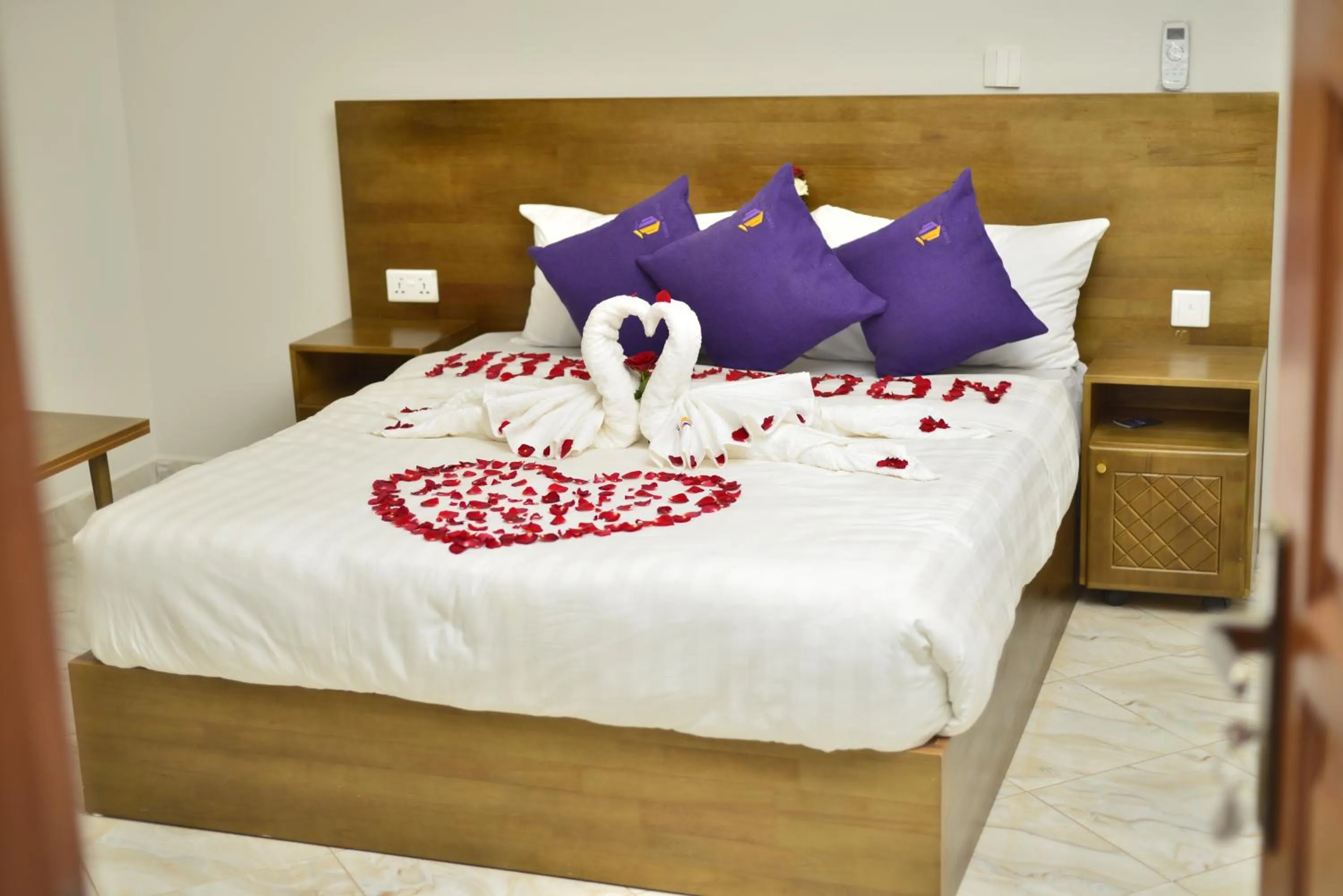 Bed in Tenda Suites and Restaurant