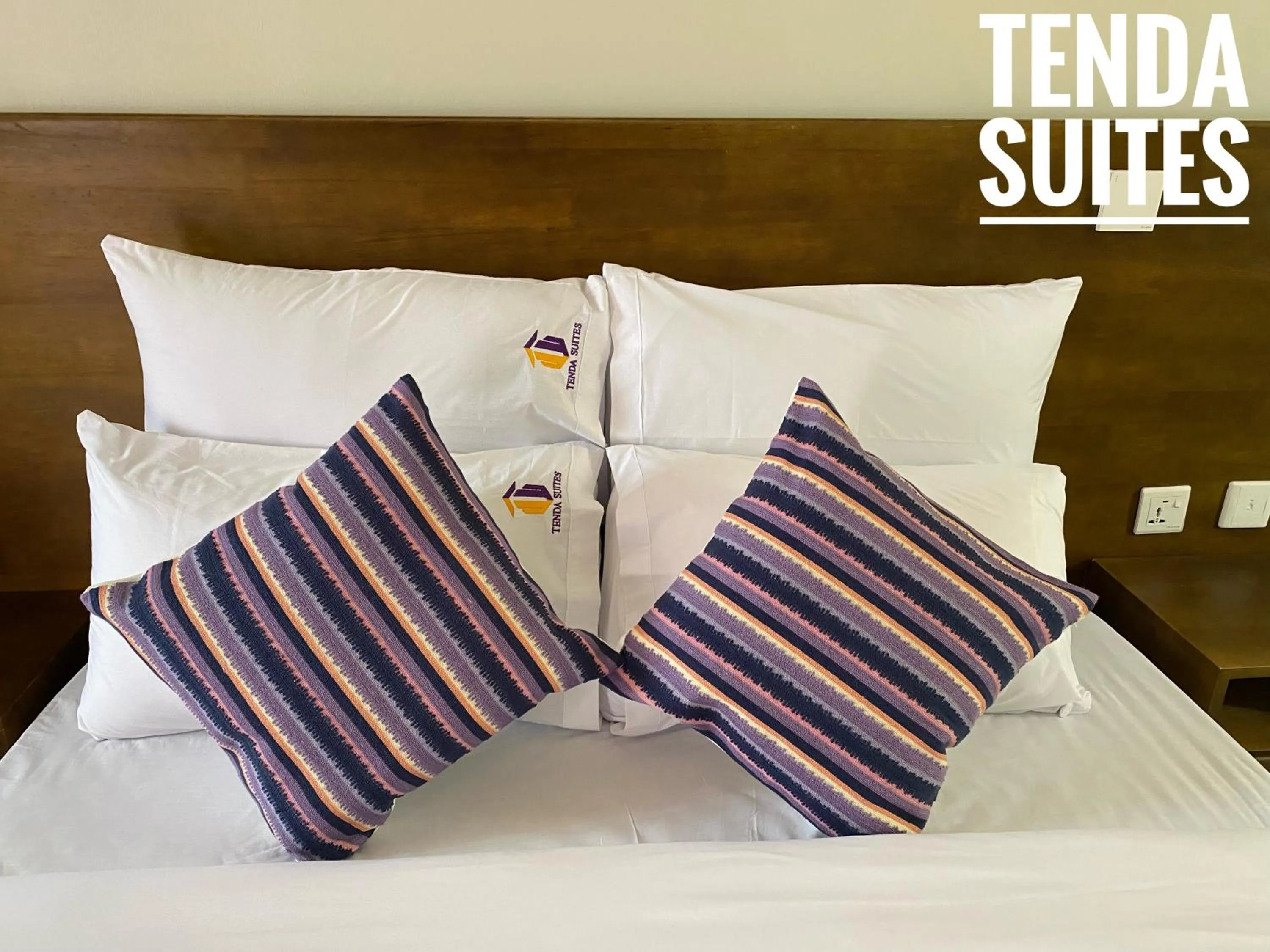 Bed in Tenda Suites and Restaurant