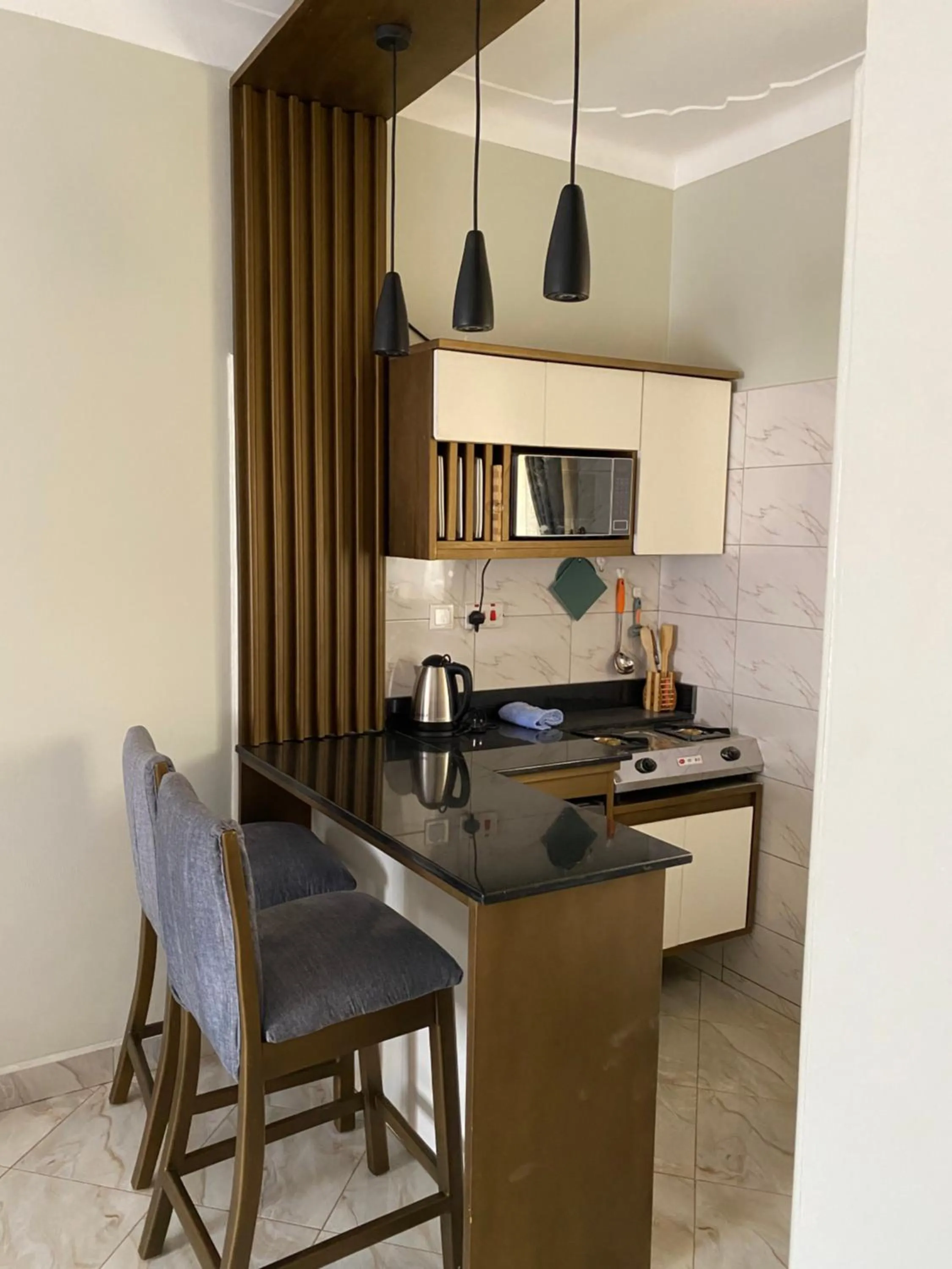 Kitchen or kitchenette in Tenda Suites and Restaurant