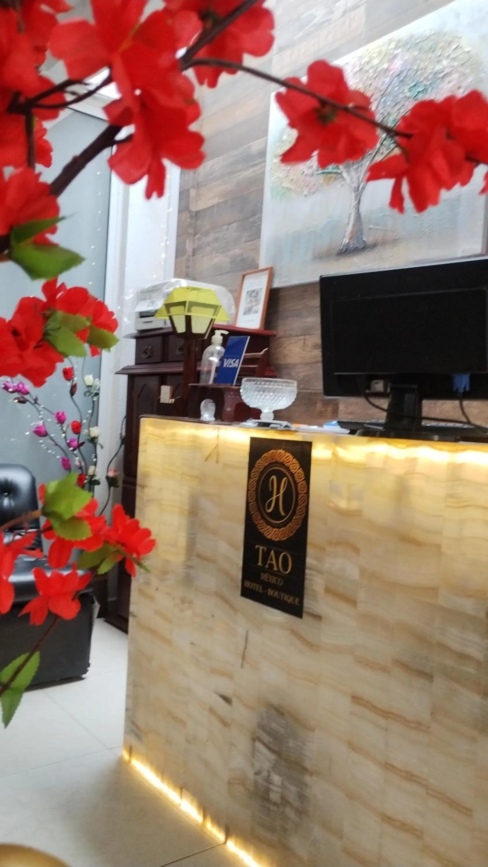 Property logo or sign in Hotel Tao