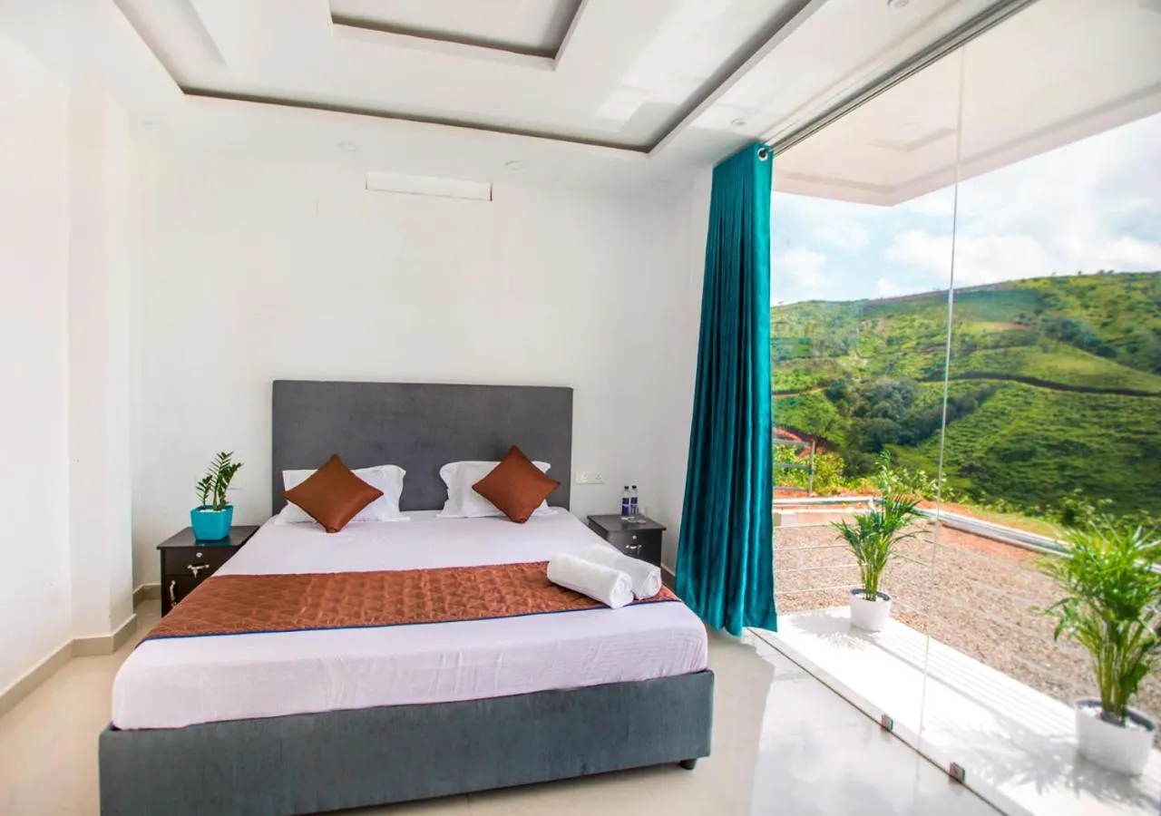 Bed in Hidden Valley Cottage Vagamon