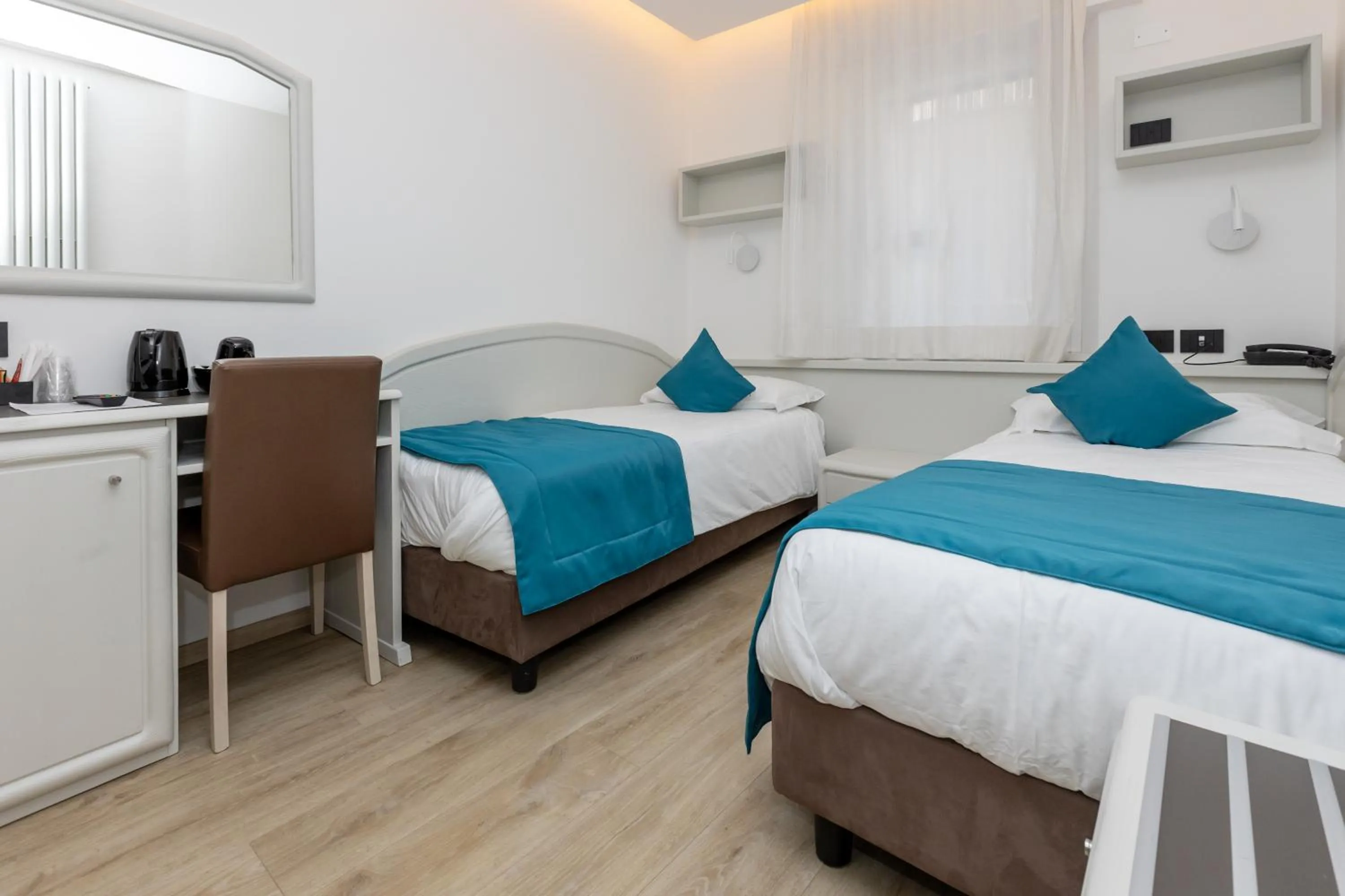 Bed in Albergo Cappello e Cadore