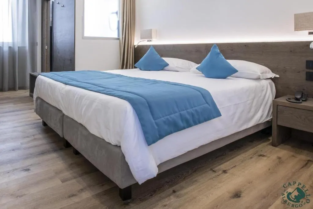 Bed in Albergo Cappello e Cadore