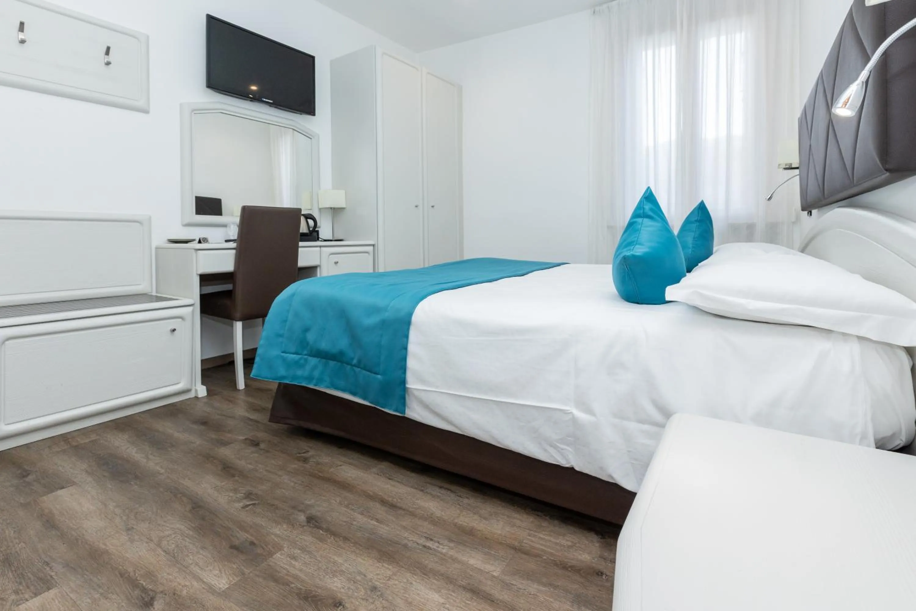 Bed in Albergo Cappello e Cadore