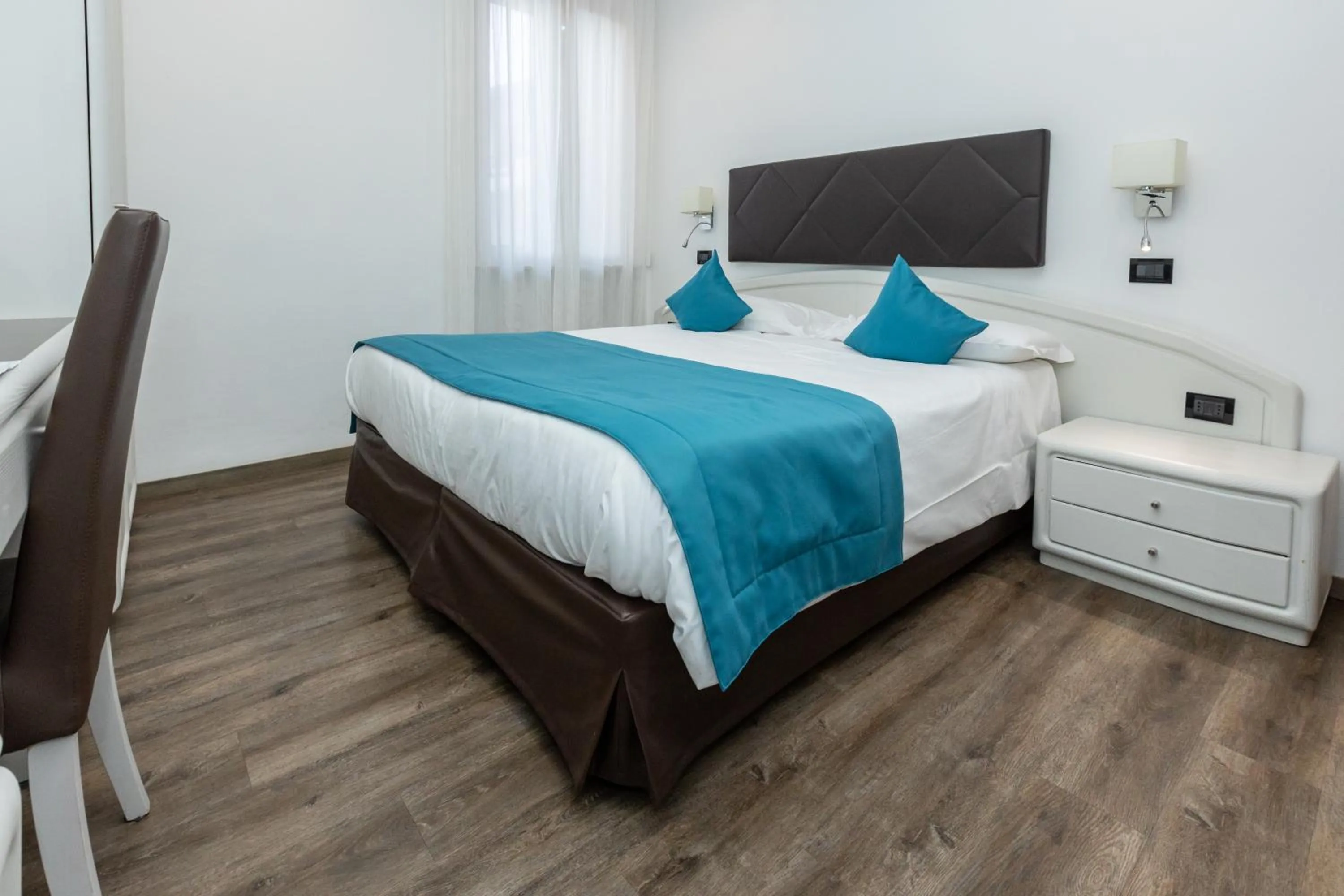 Bed in Albergo Cappello e Cadore