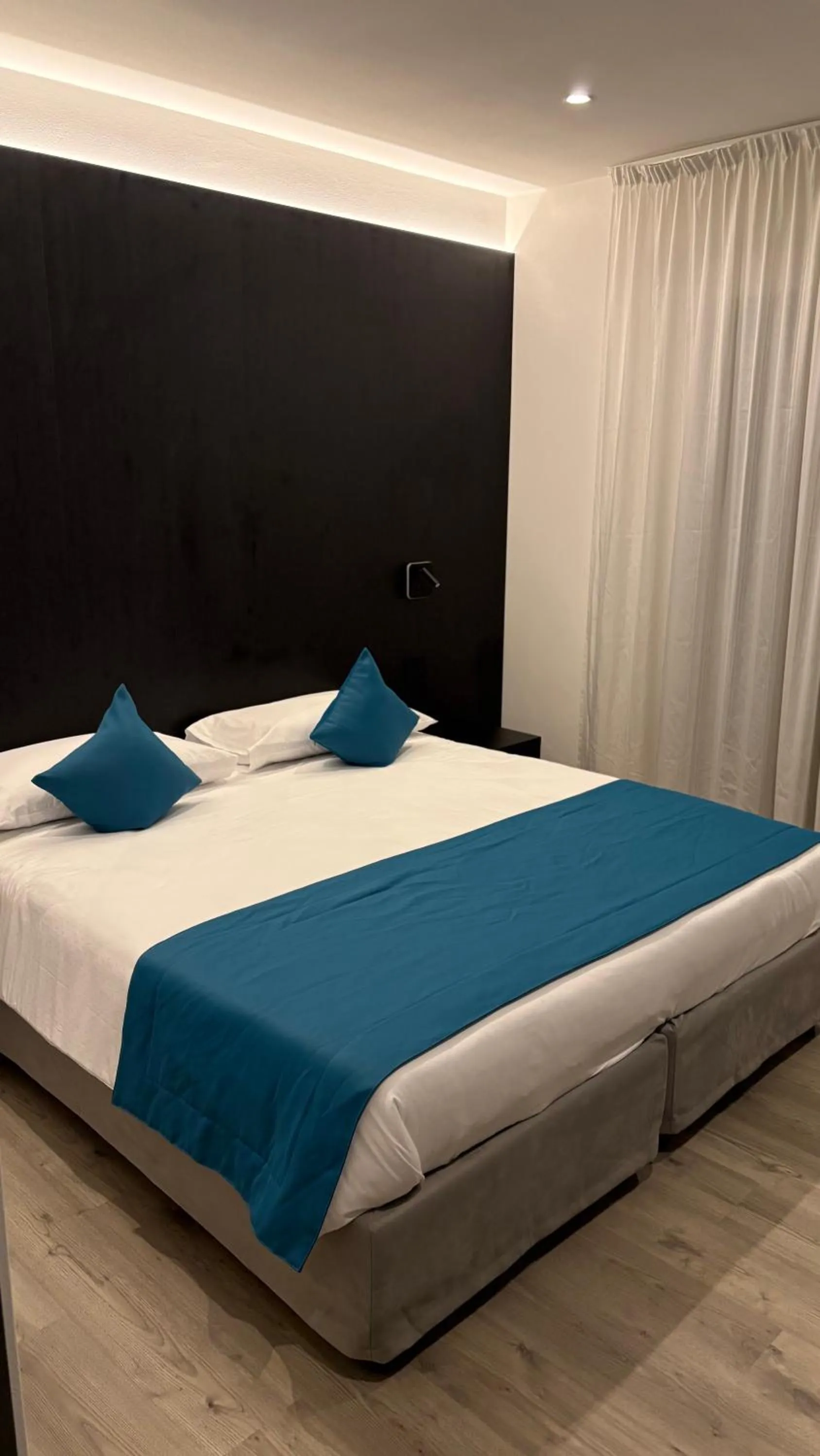 Bed in Albergo Cappello e Cadore