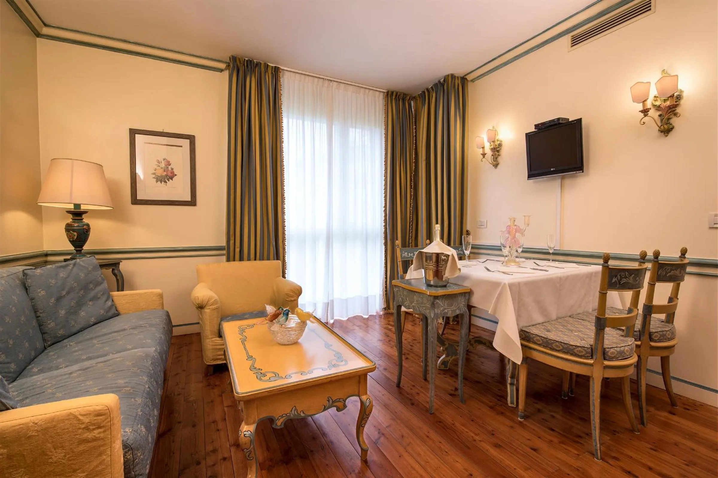 TV and multimedia in DB Villas Le Ville del Lido Resort