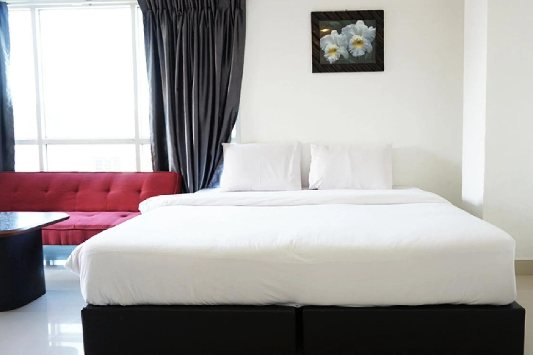 Bed in Latin Garden Hotel