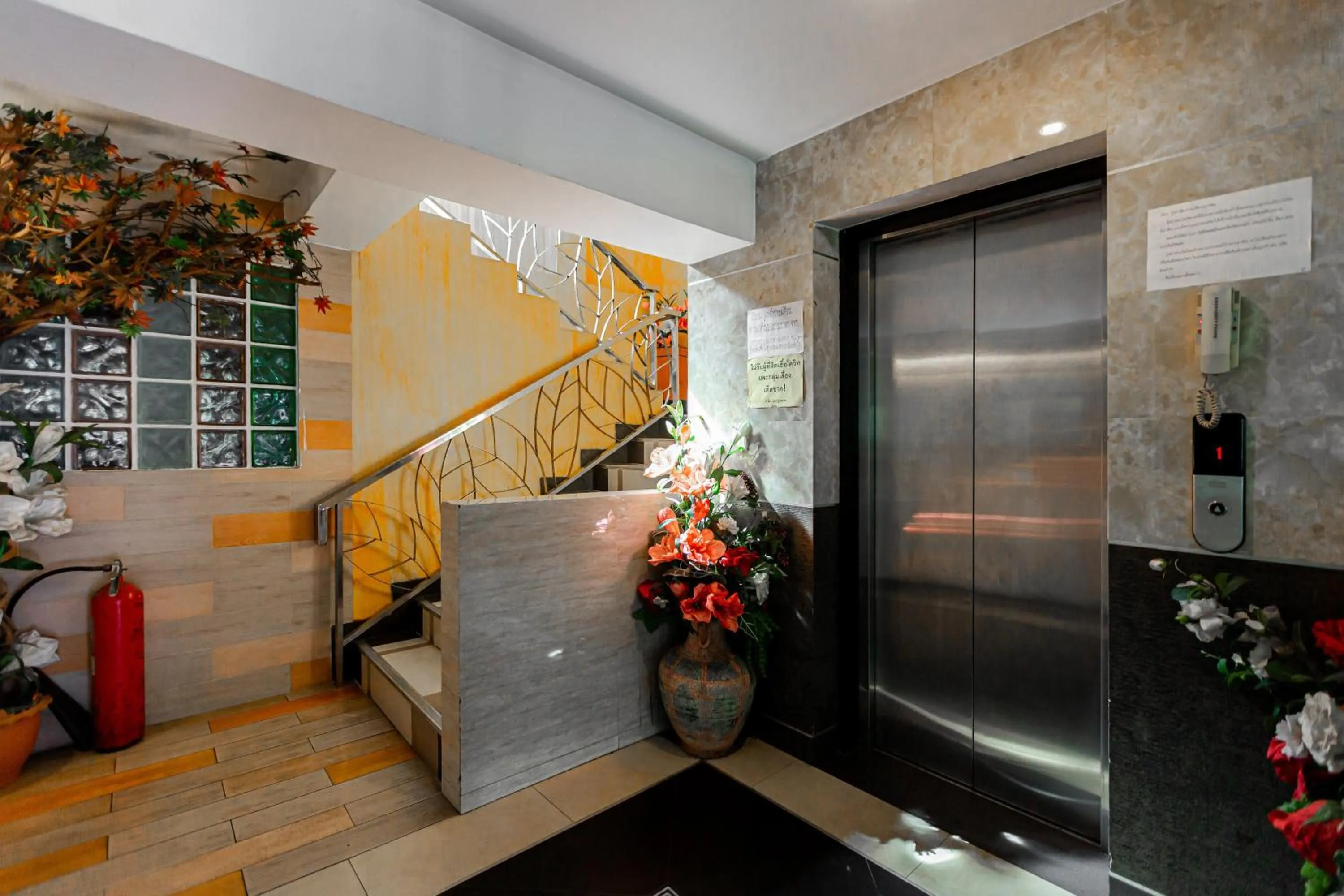 elevator in Latin Garden Hotel