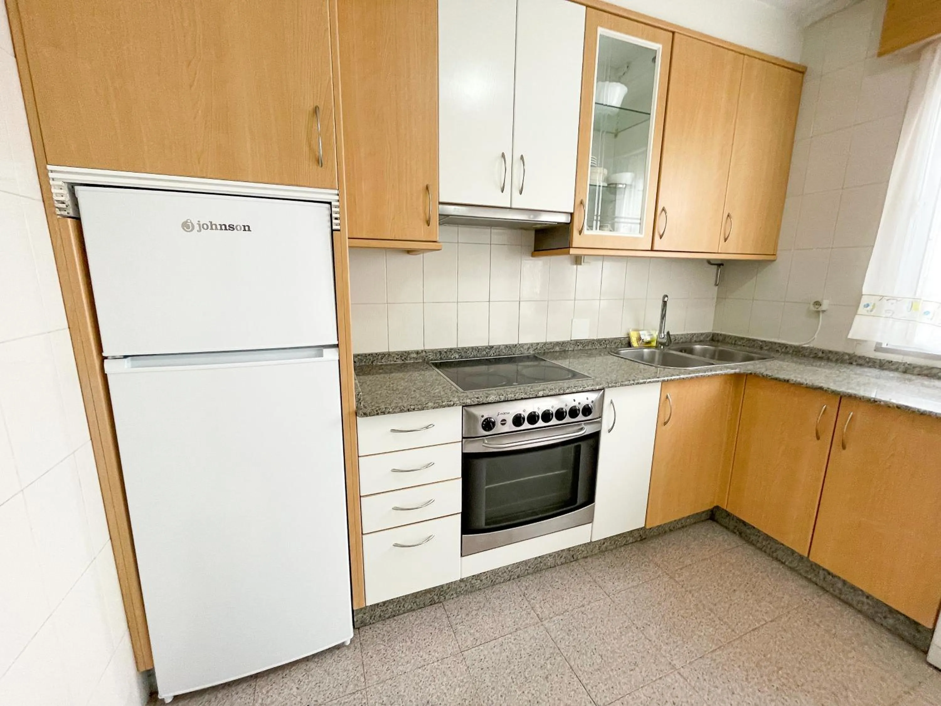 Kitchen or kitchenette in Apartamentos Portonovo 3000