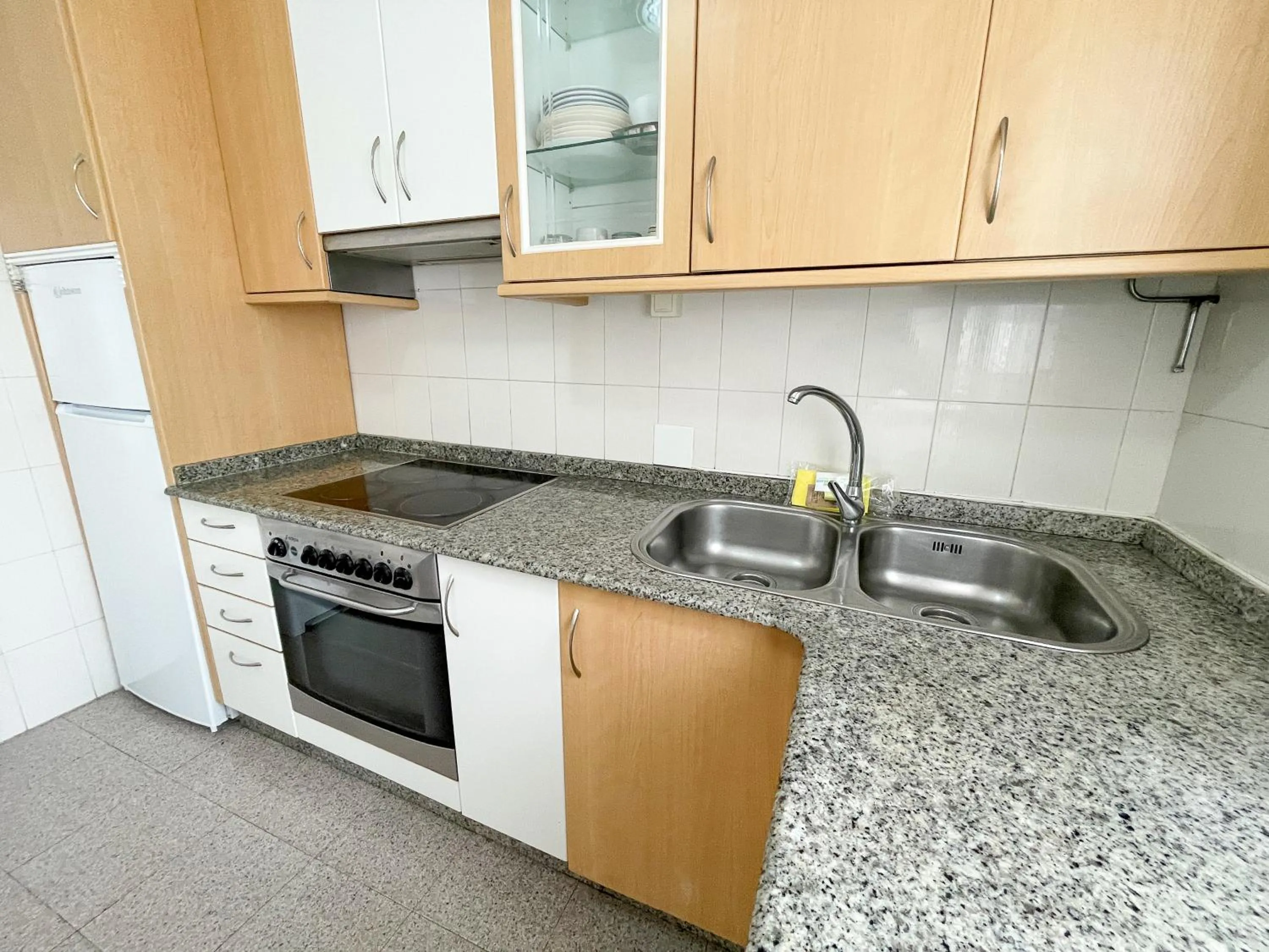 Kitchen or kitchenette in Apartamentos Portonovo 3000
