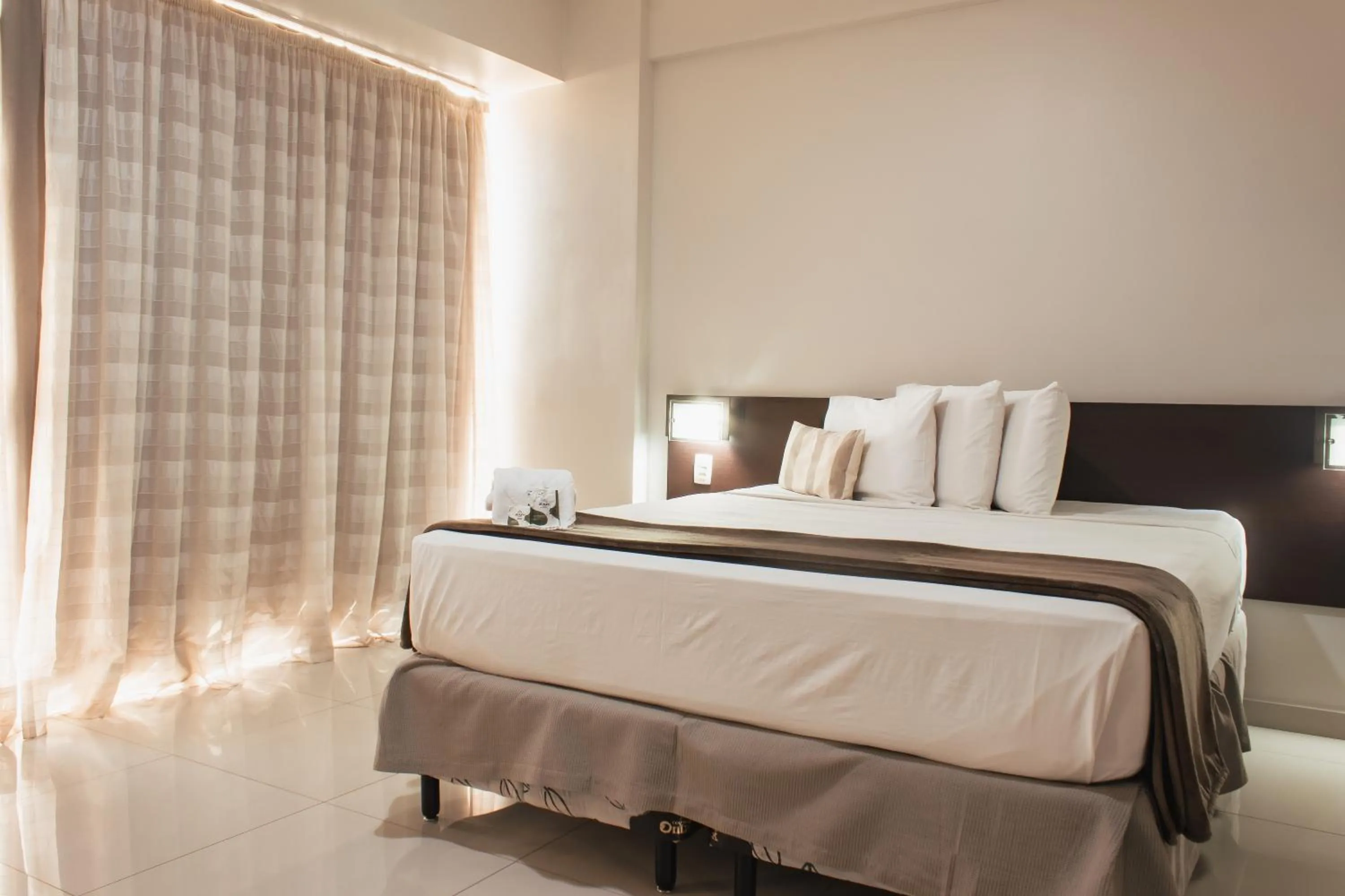 Bed in Atrium Express Hotels