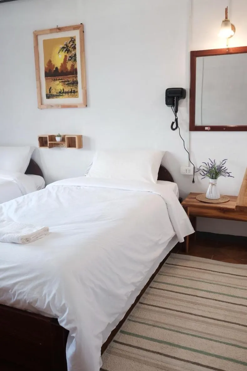 Bed in Sabaydee Guesthouse