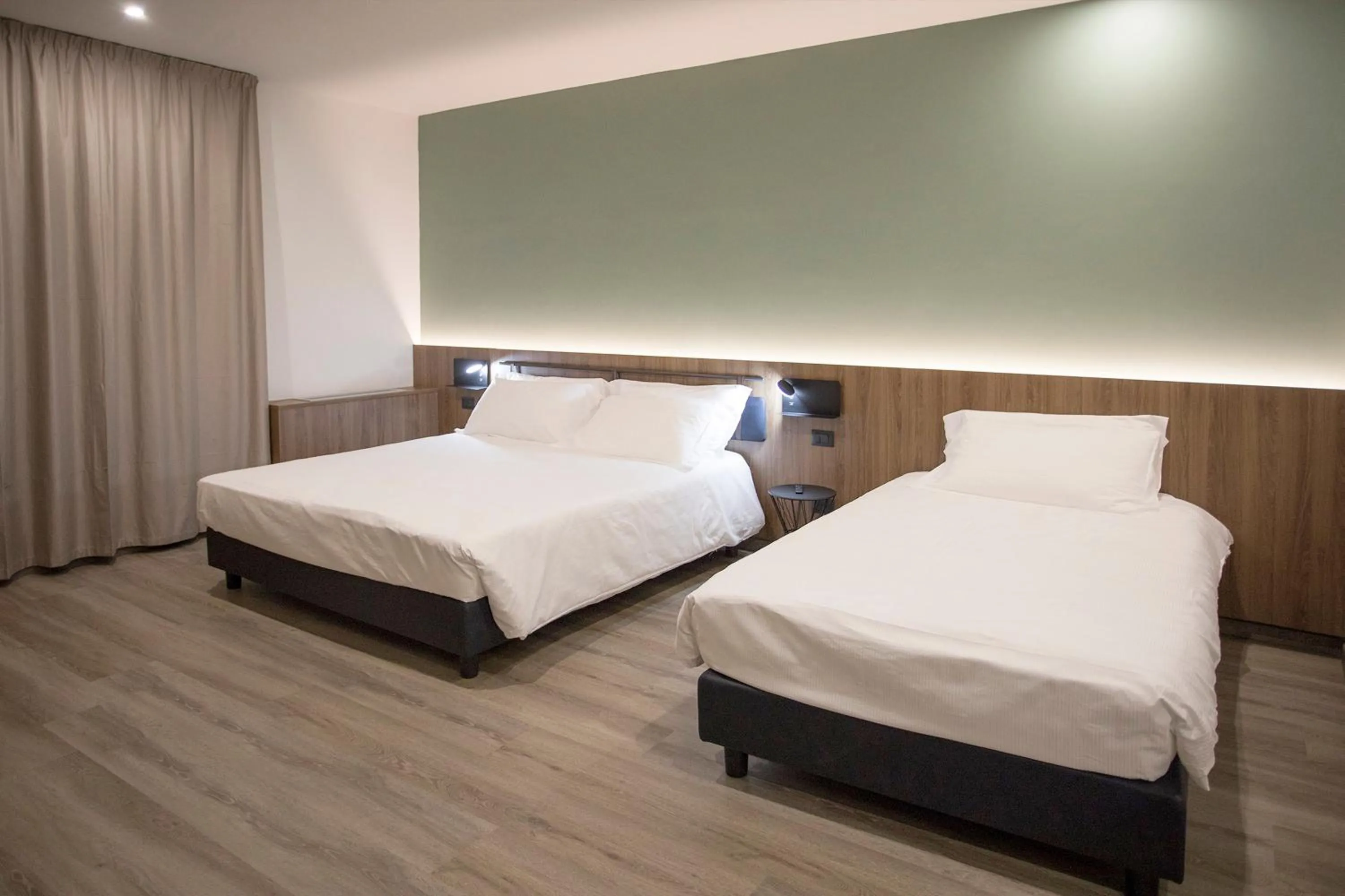 Bed in Moody smart & comfy Hotel