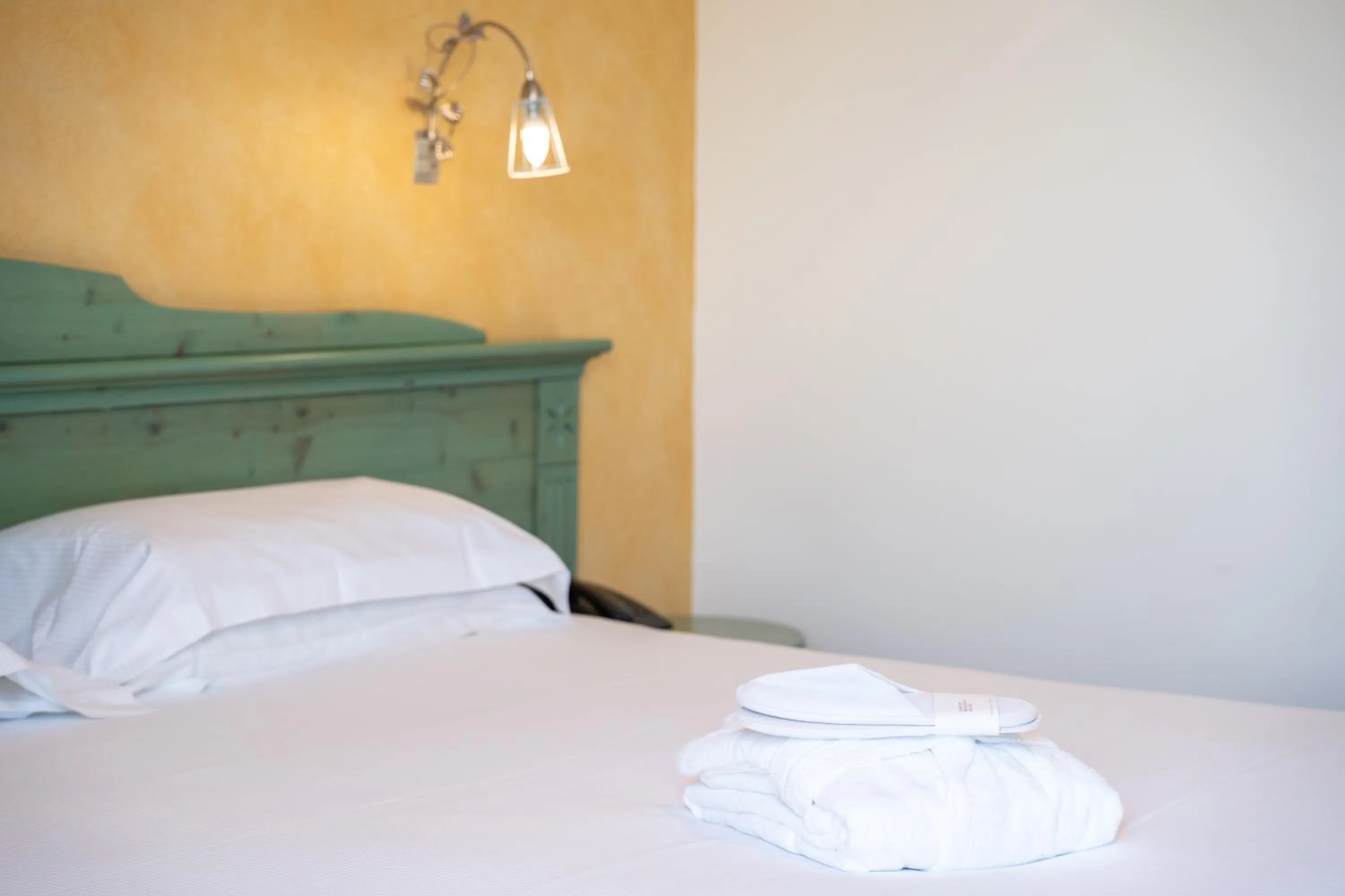 Bed in Hotel Residence Montelago