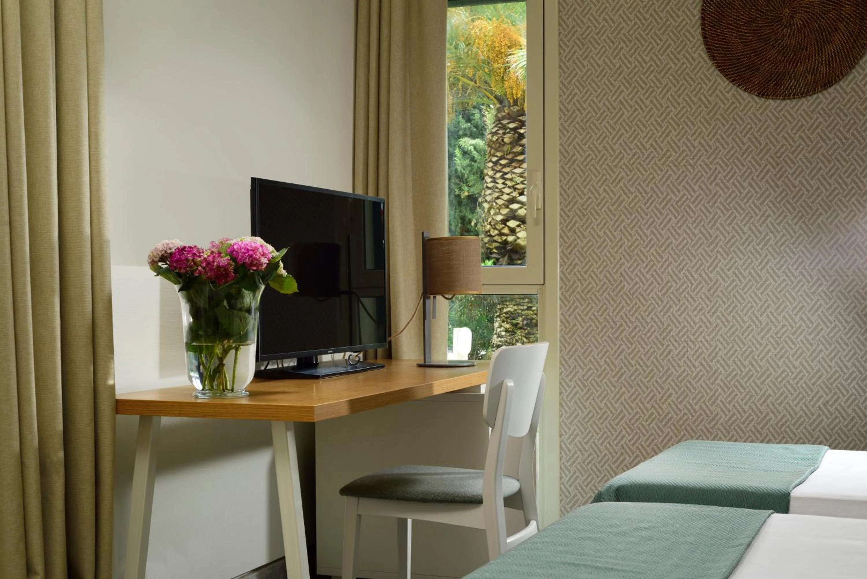 Seating area, Bed in UNA Hotels Naxos Beach Sicilia