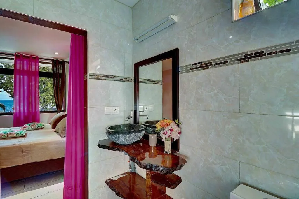 Bathroom, Bed in Tahiti beach house