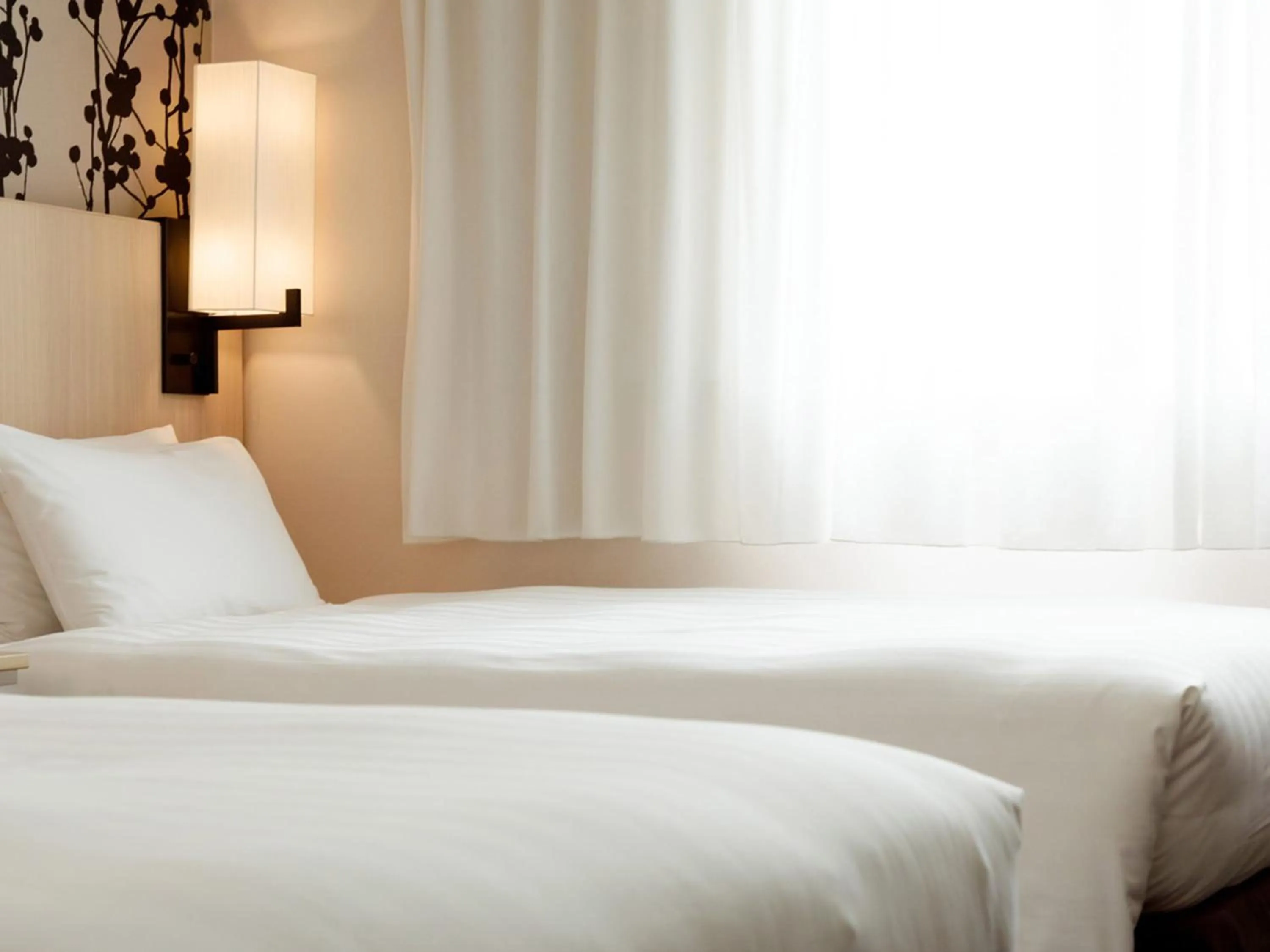 Photo of the whole room, Bed in Nishitetsu Resort Inn Beppu