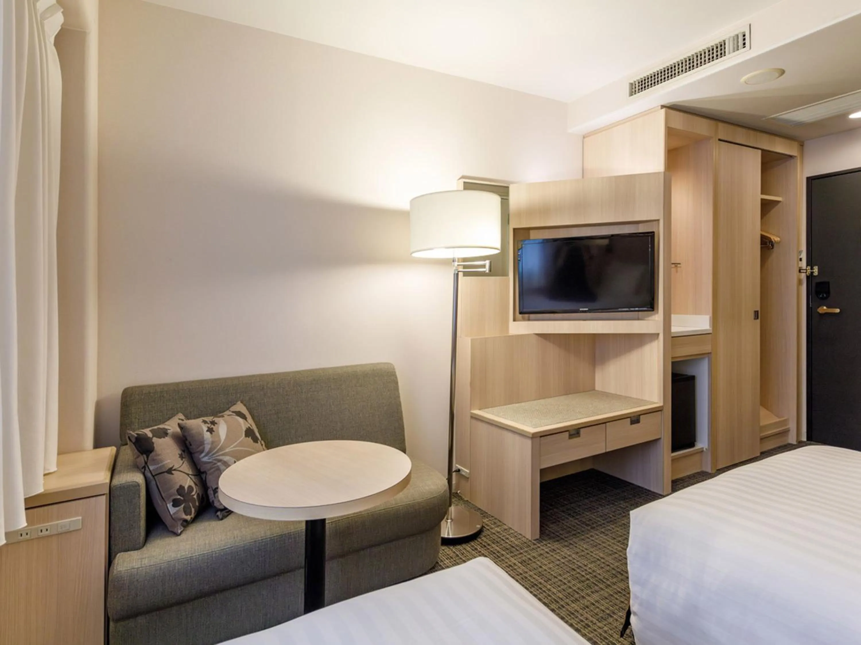 Photo of the whole room, Bed in Nishitetsu Resort Inn Beppu