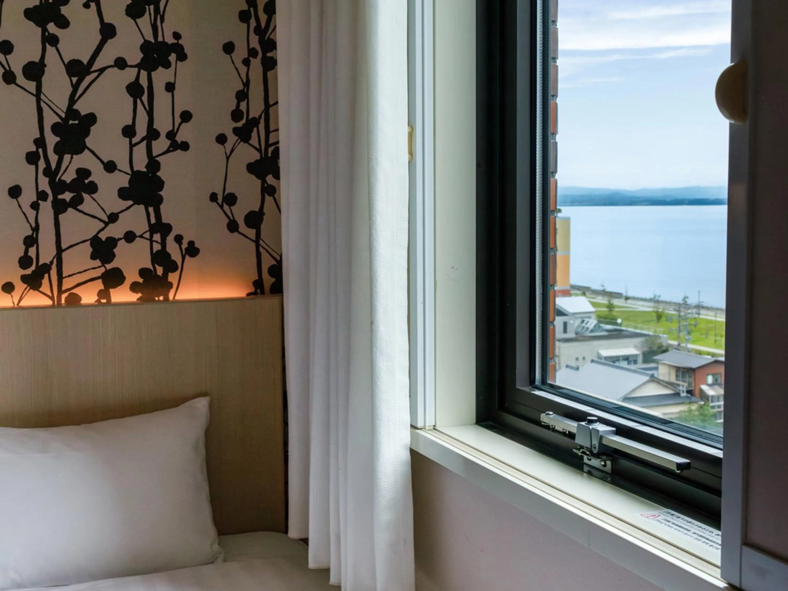 Photo of the whole room, Bed in Nishitetsu Resort Inn Beppu