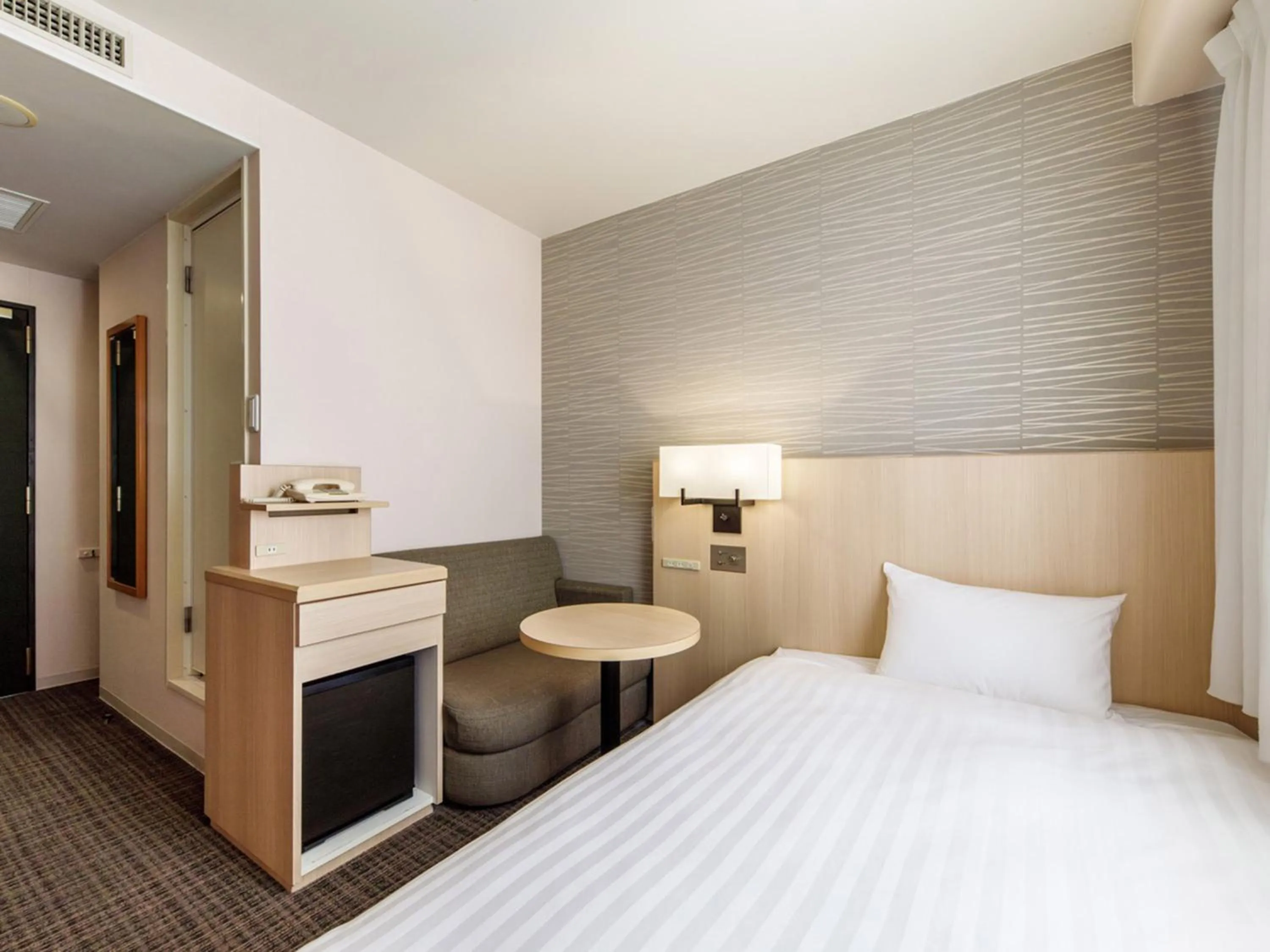 Photo of the whole room, Bed in Nishitetsu Resort Inn Beppu