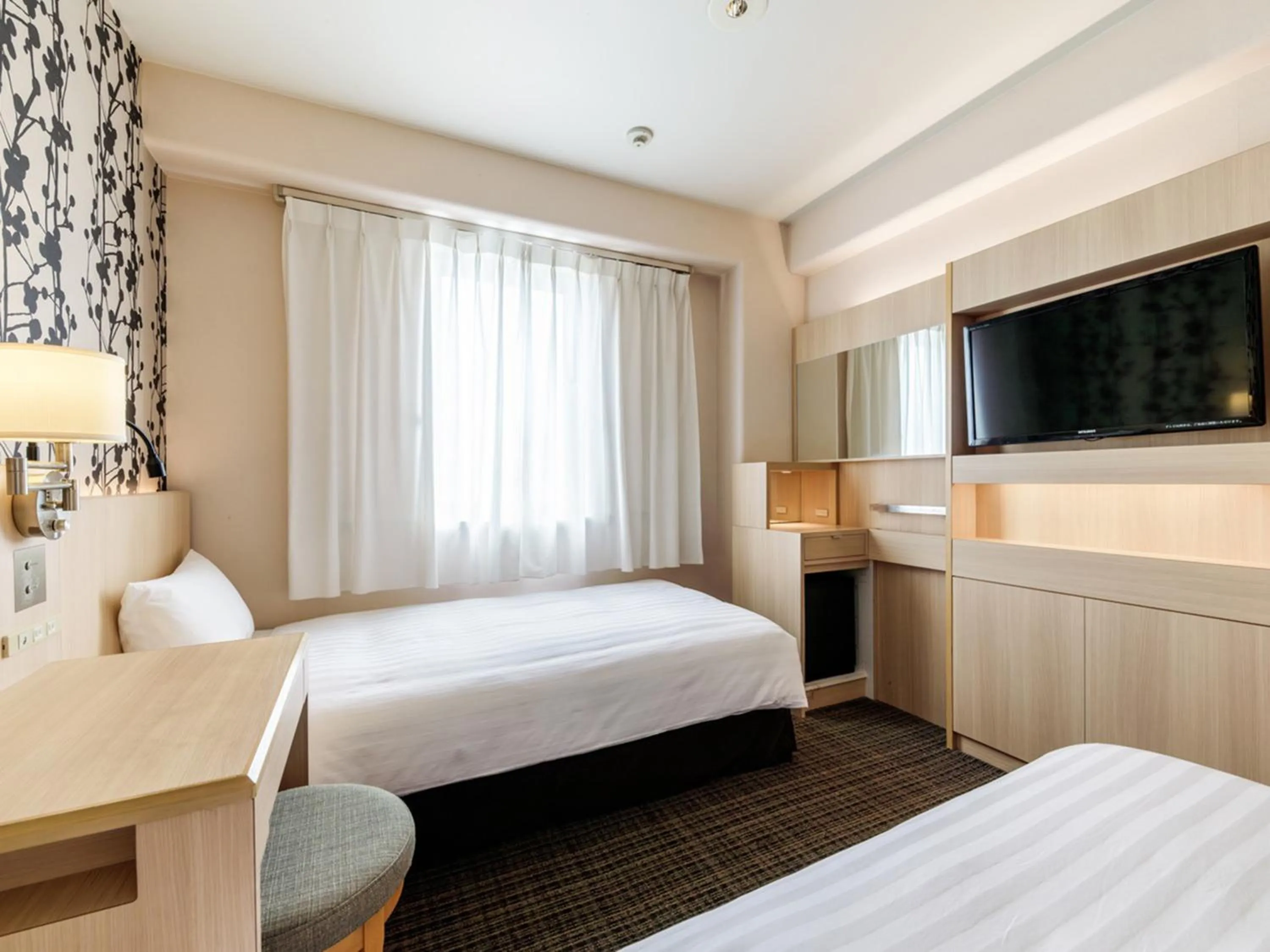 Photo of the whole room, Bed in Nishitetsu Resort Inn Beppu