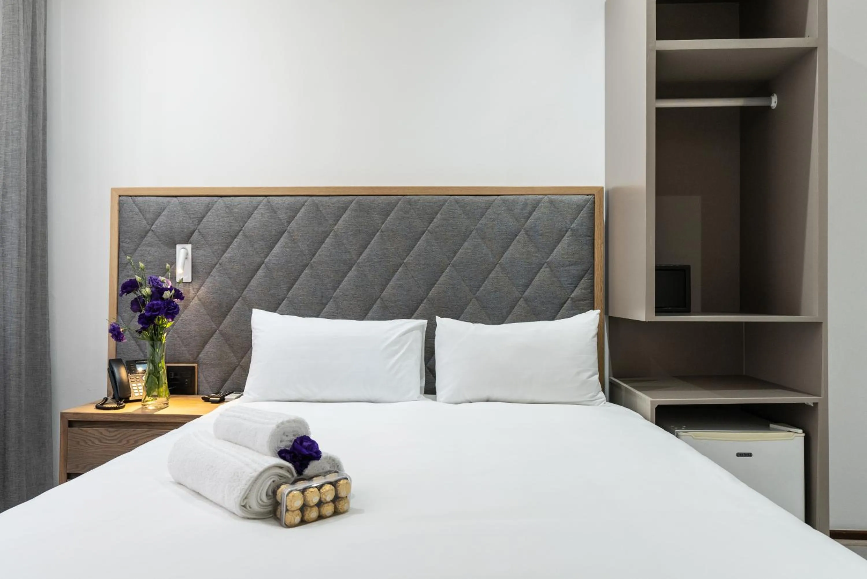 Bed in Cape Diamond Boutique Hotel