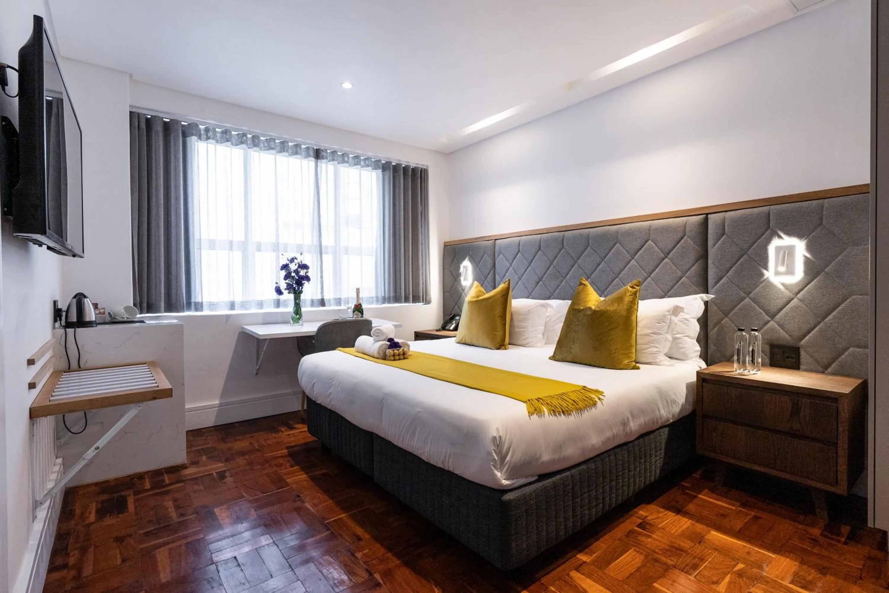 Bed in Cape Diamond Boutique Hotel