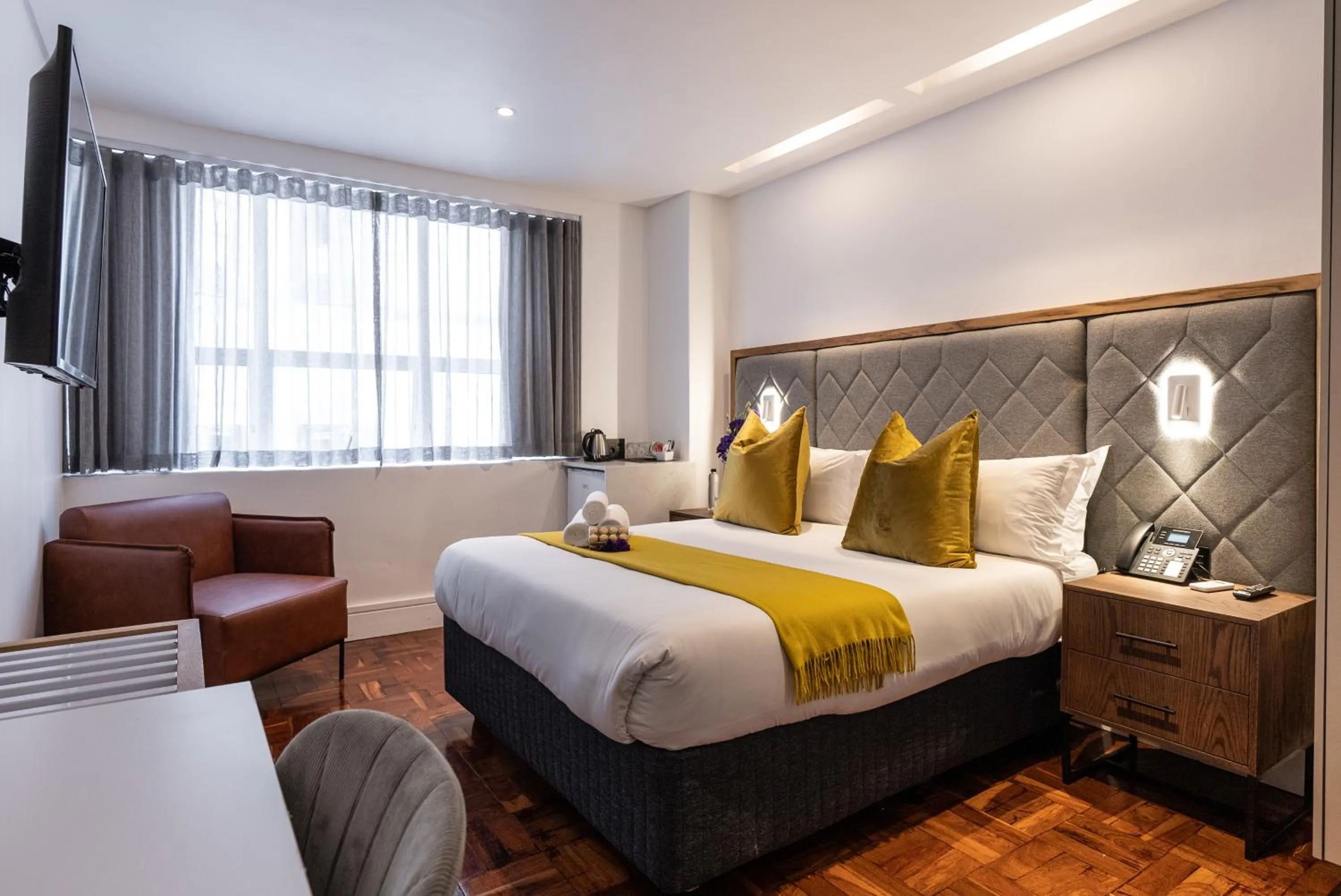 Bed in Cape Diamond Boutique Hotel