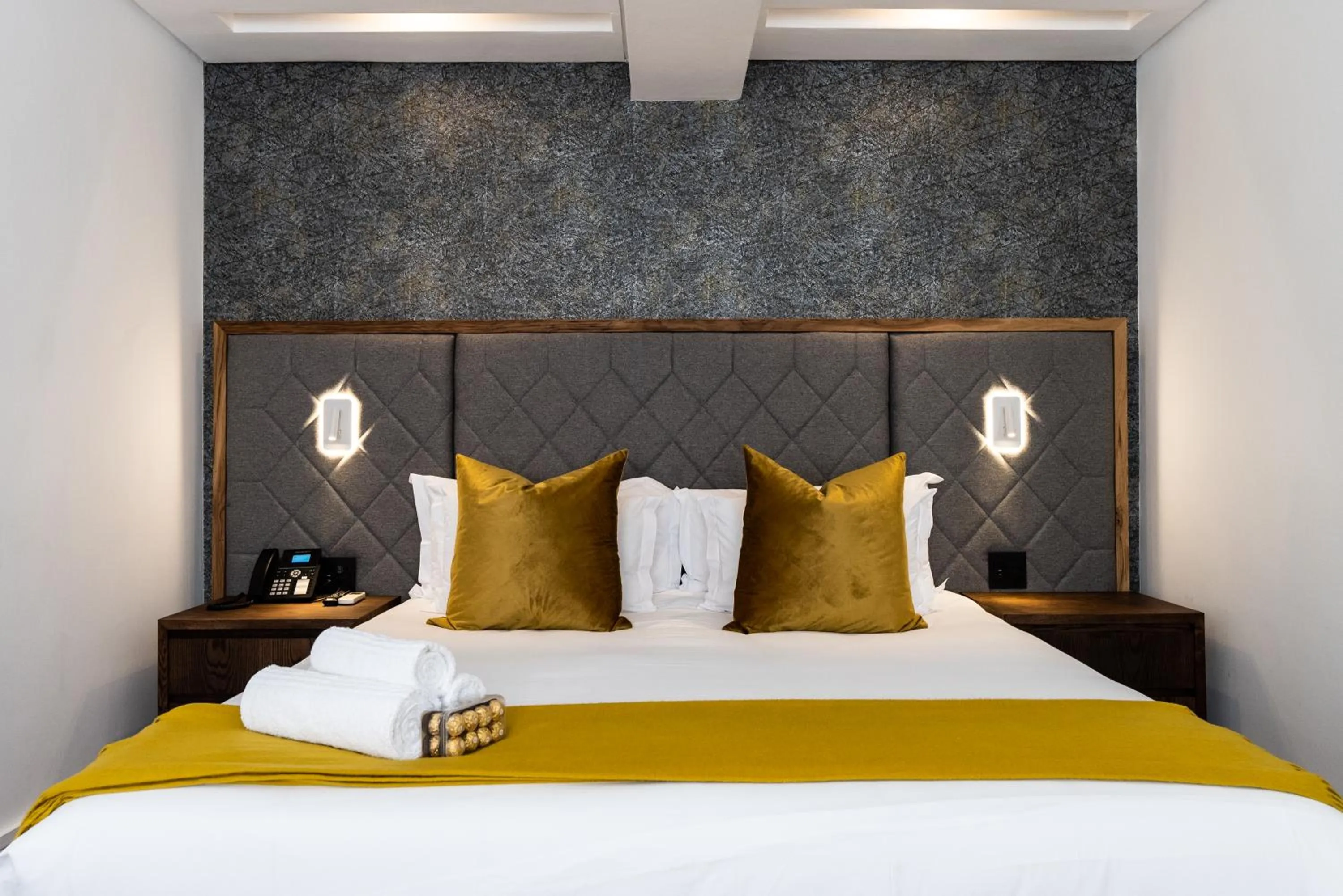 Bed in Cape Diamond Boutique Hotel