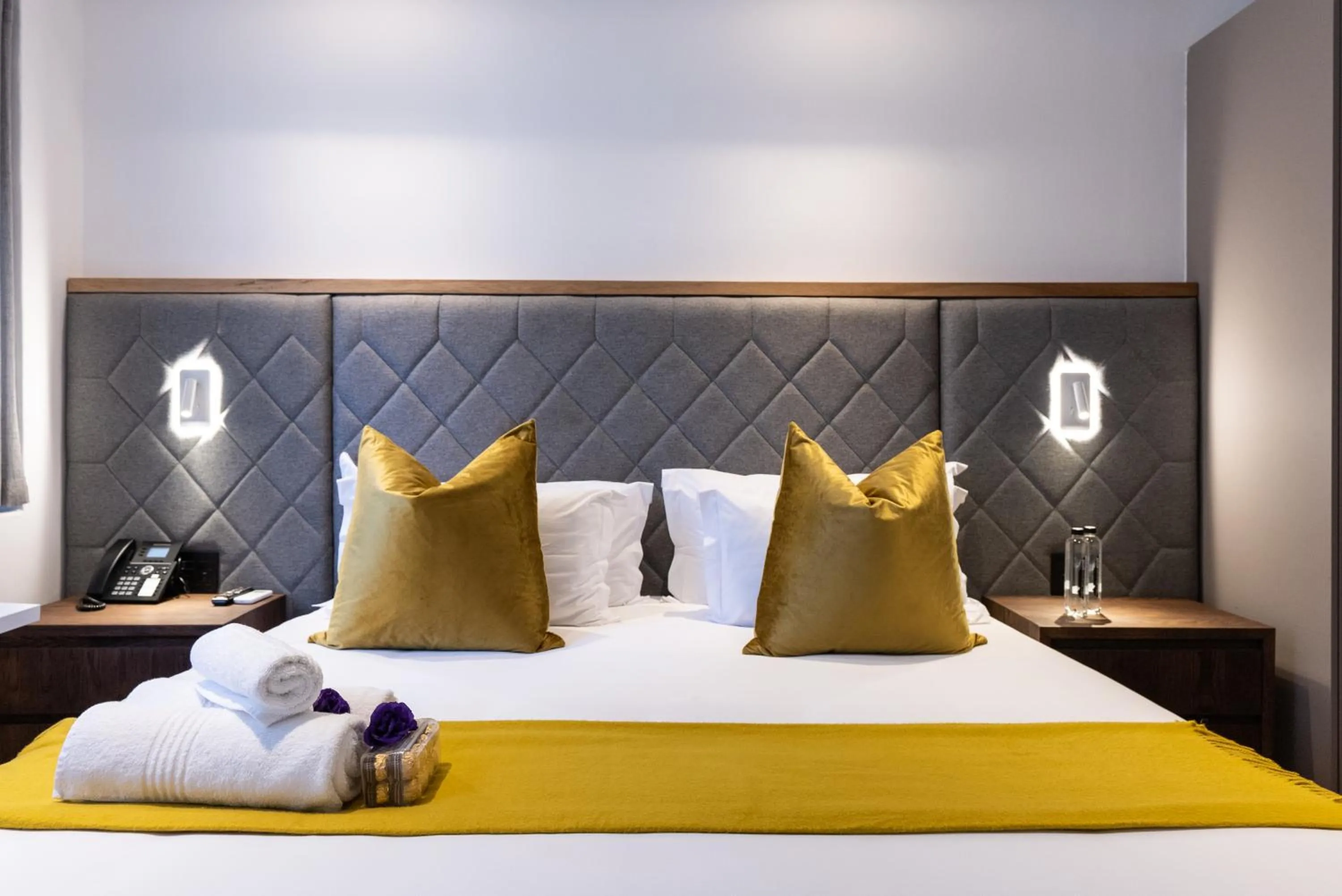 Bed in Cape Diamond Boutique Hotel