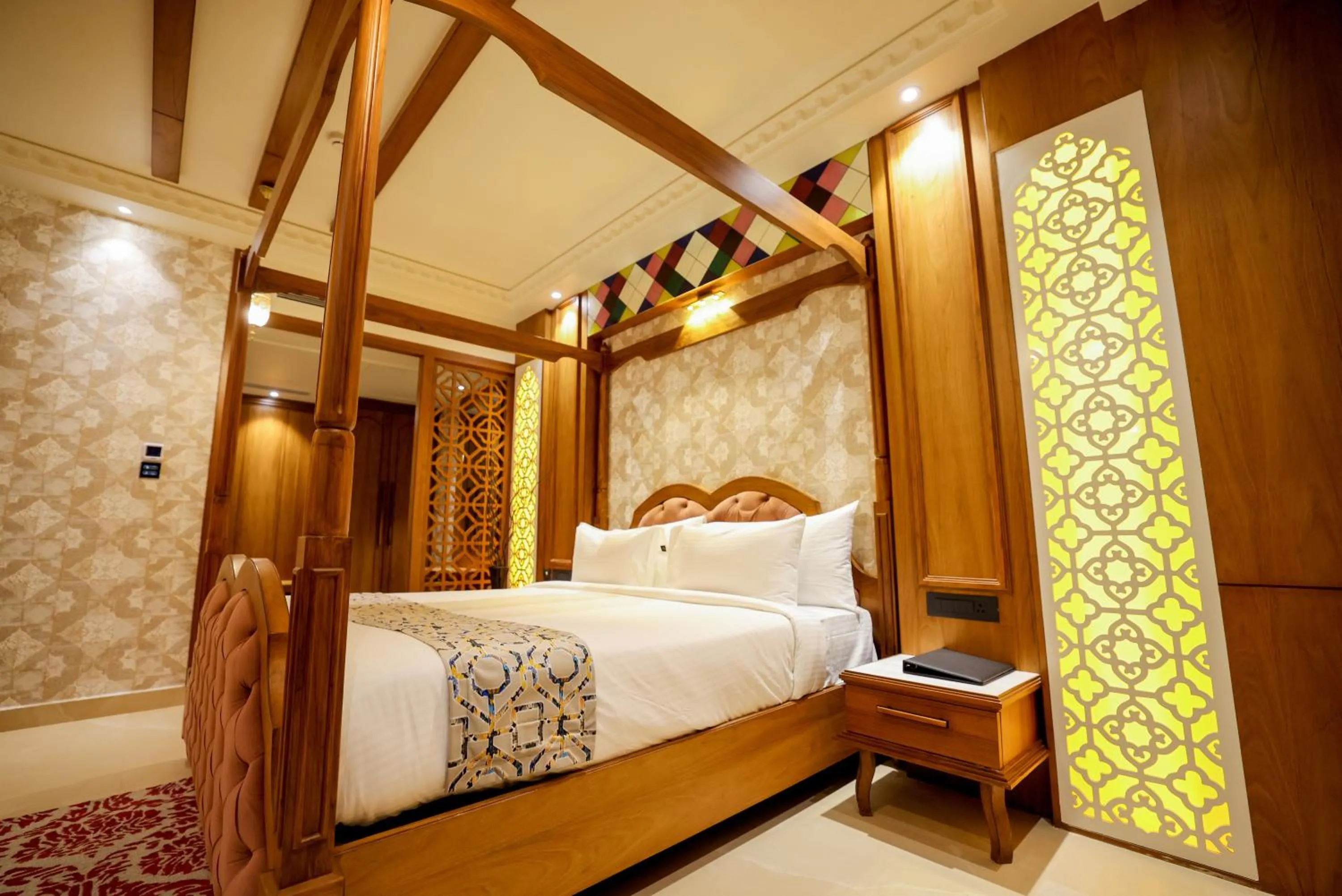 Bed in AJ Grand Hotel