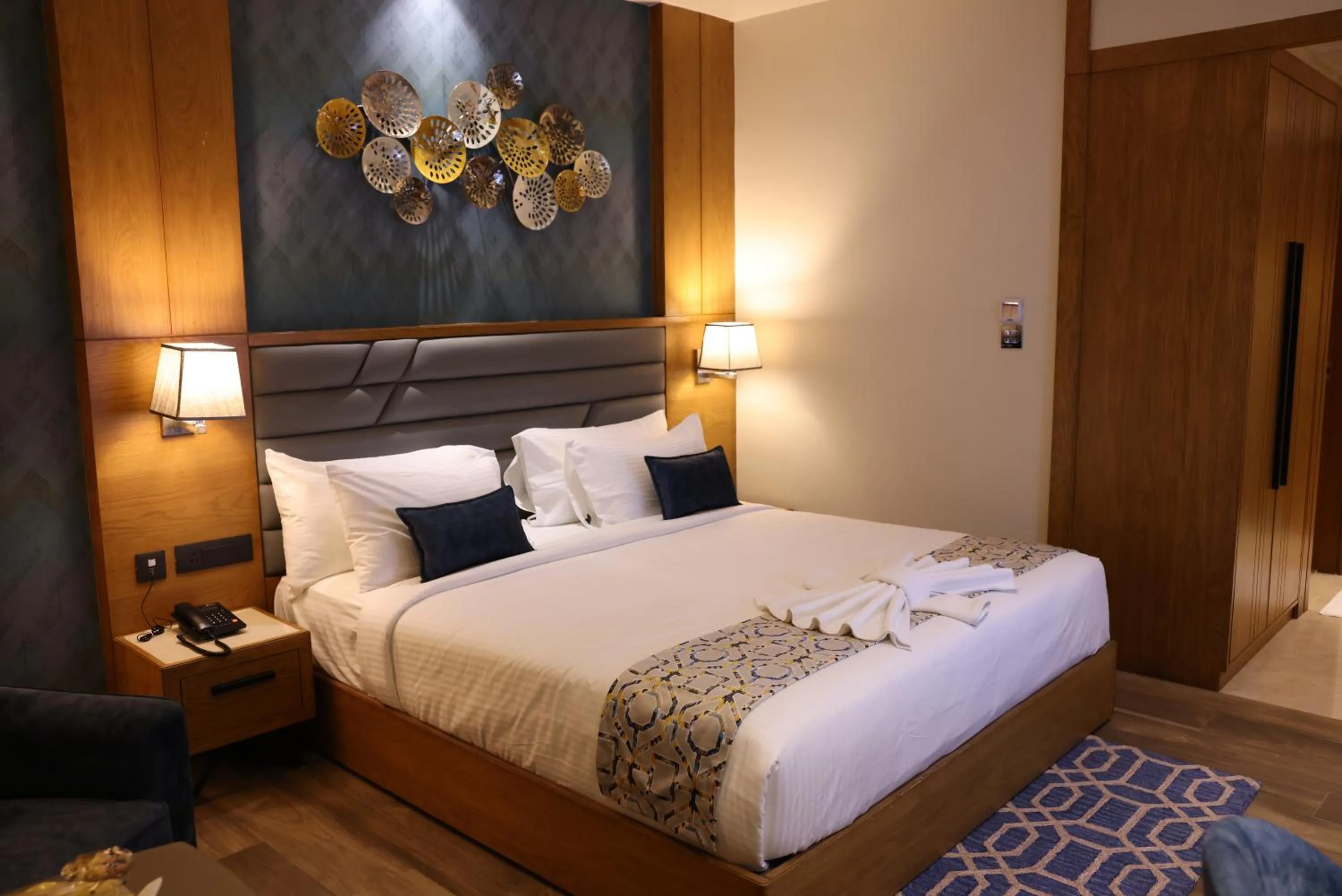 Bed in AJ Grand Hotel