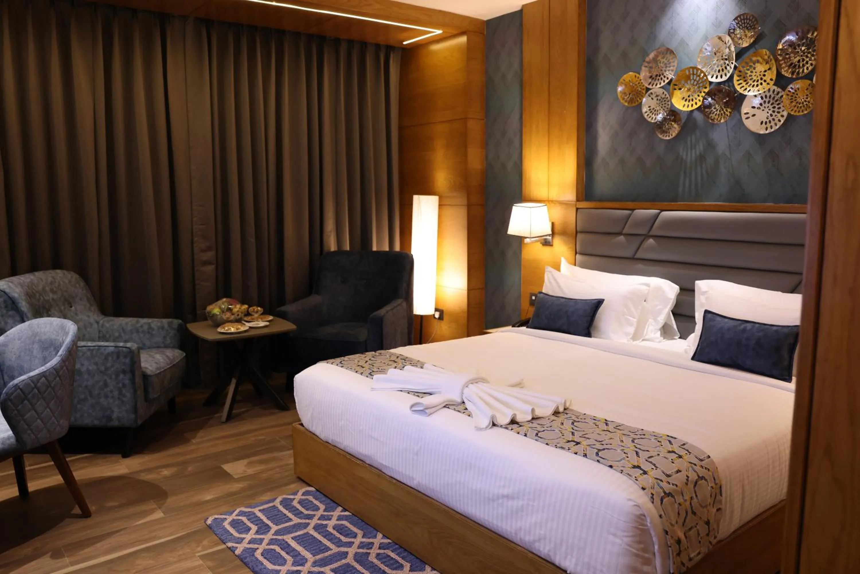 Bed in AJ Grand Hotel