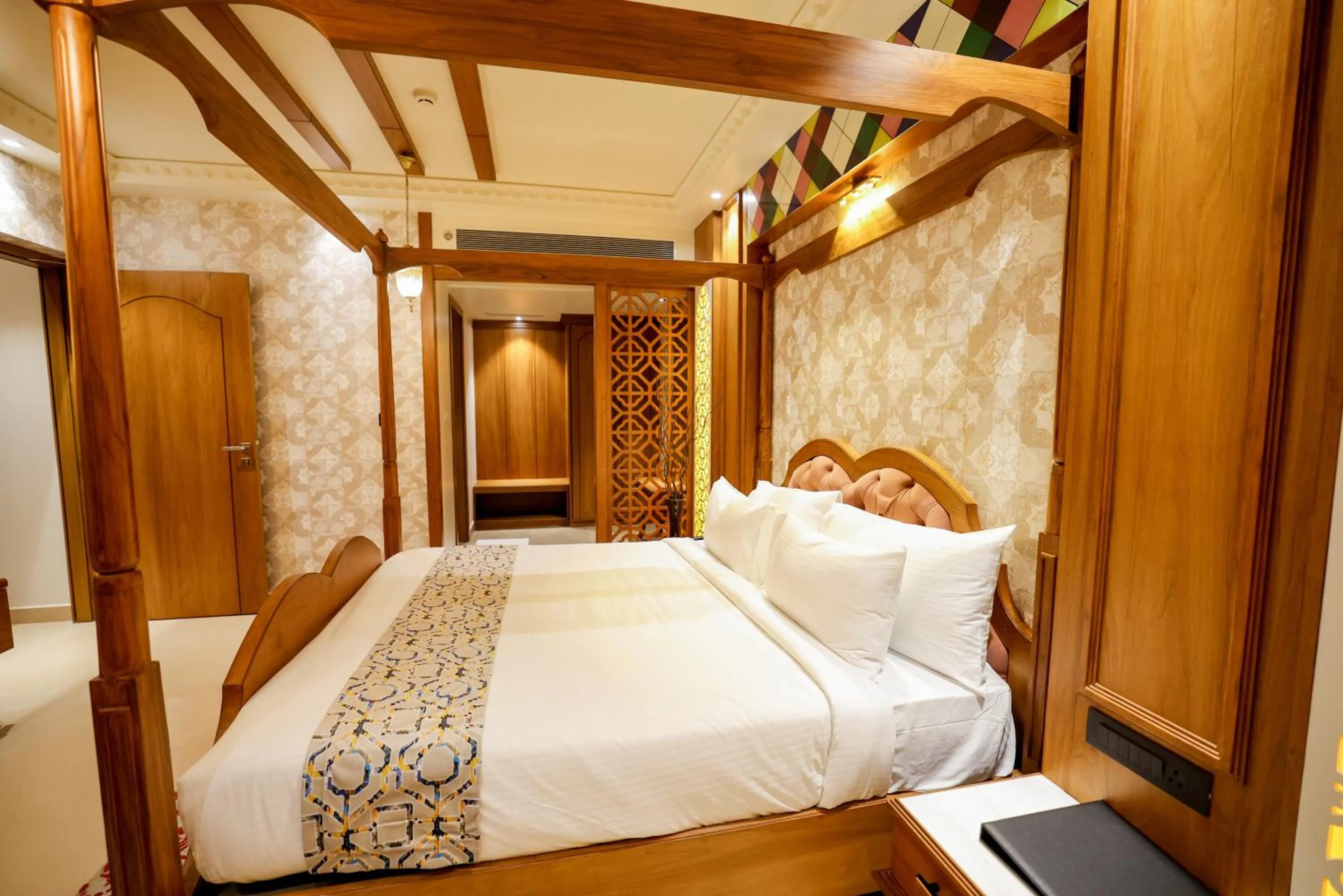 Bed in AJ Grand Hotel