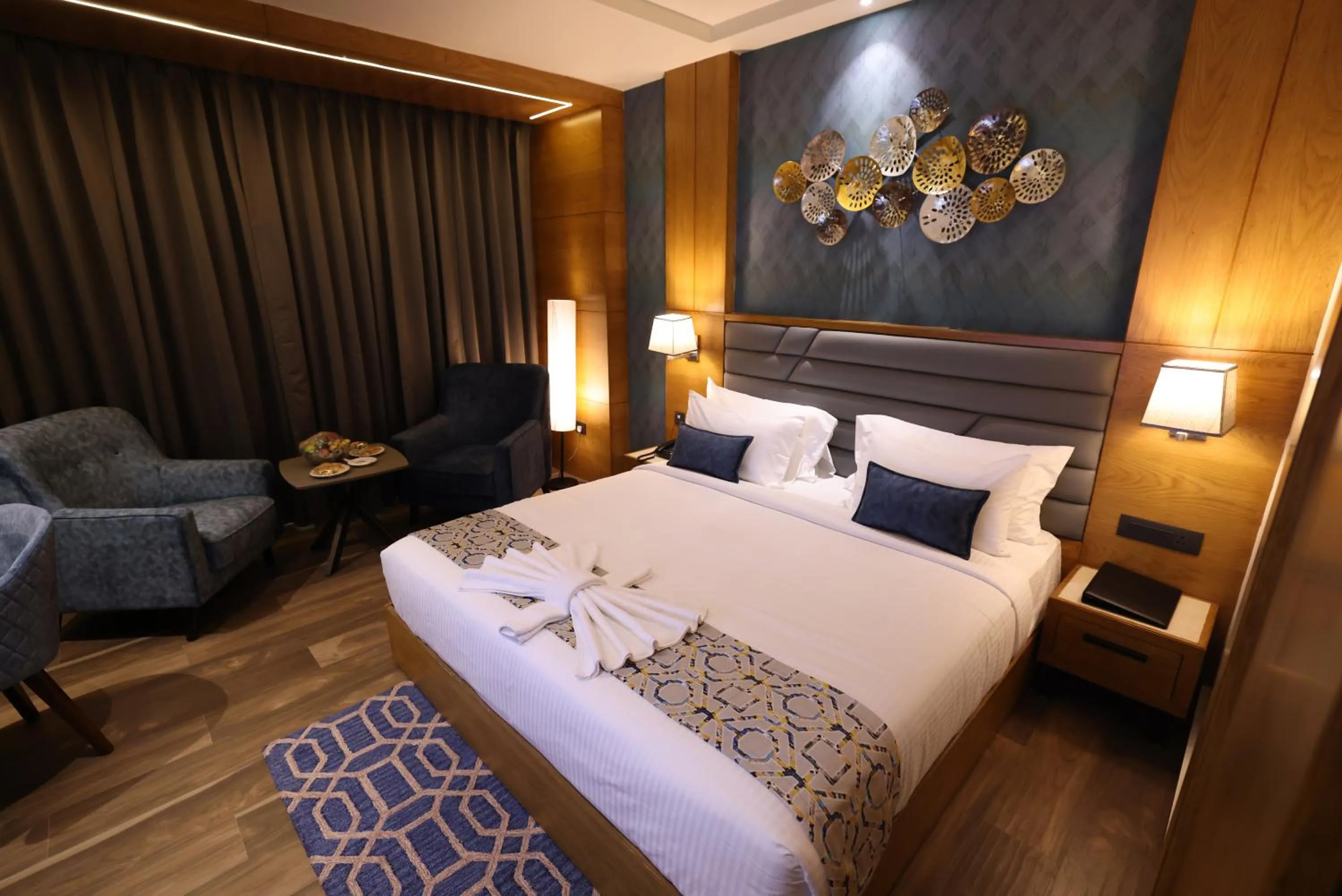 Bed in AJ Grand Hotel