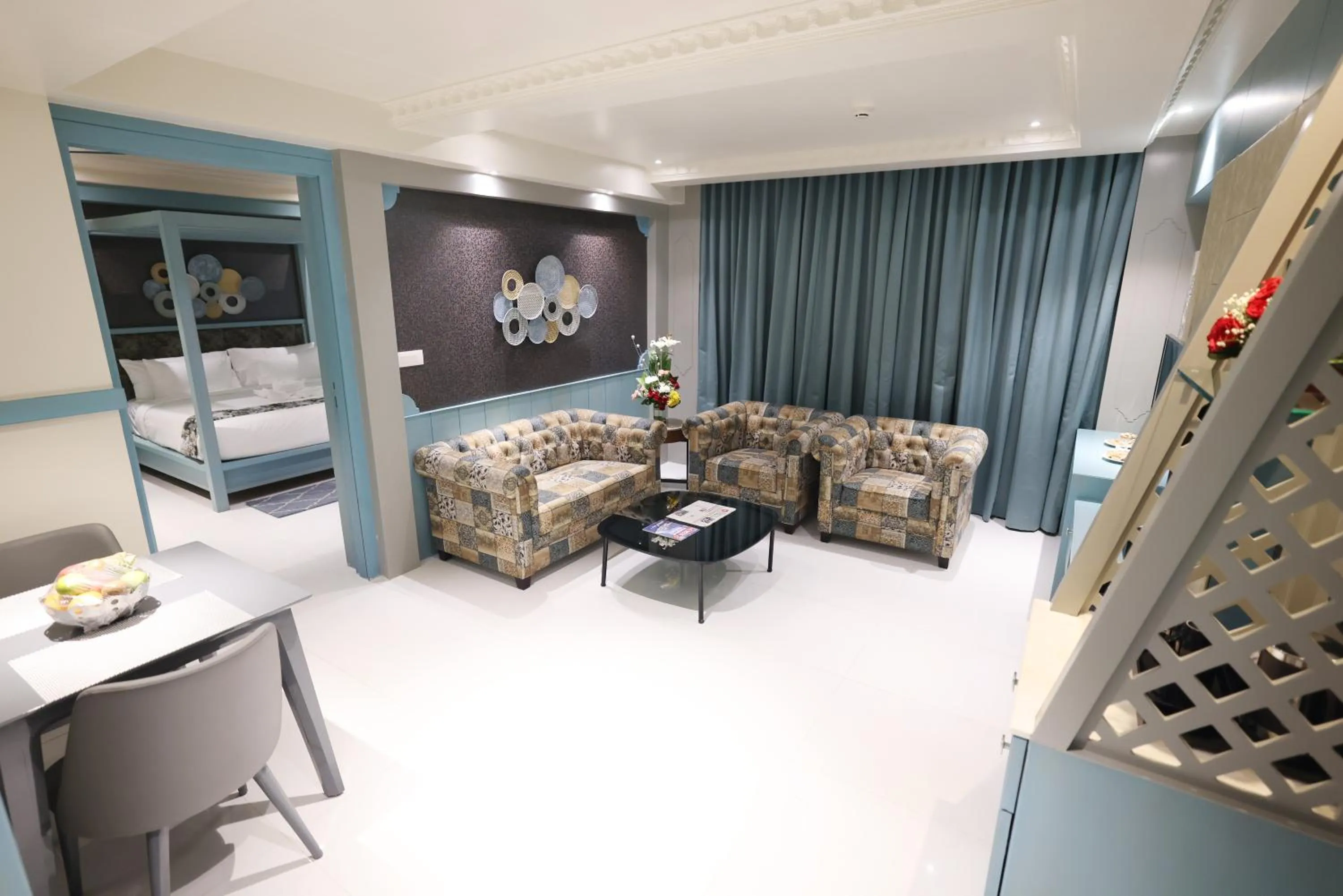 Living room, Bed in AJ Grand Hotel