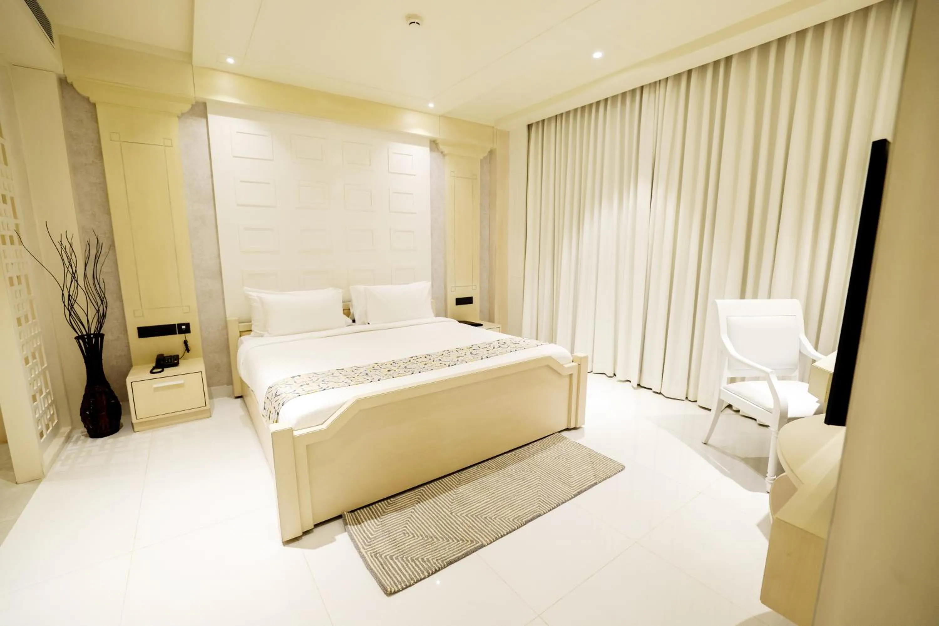 Bed in AJ Grand Hotel