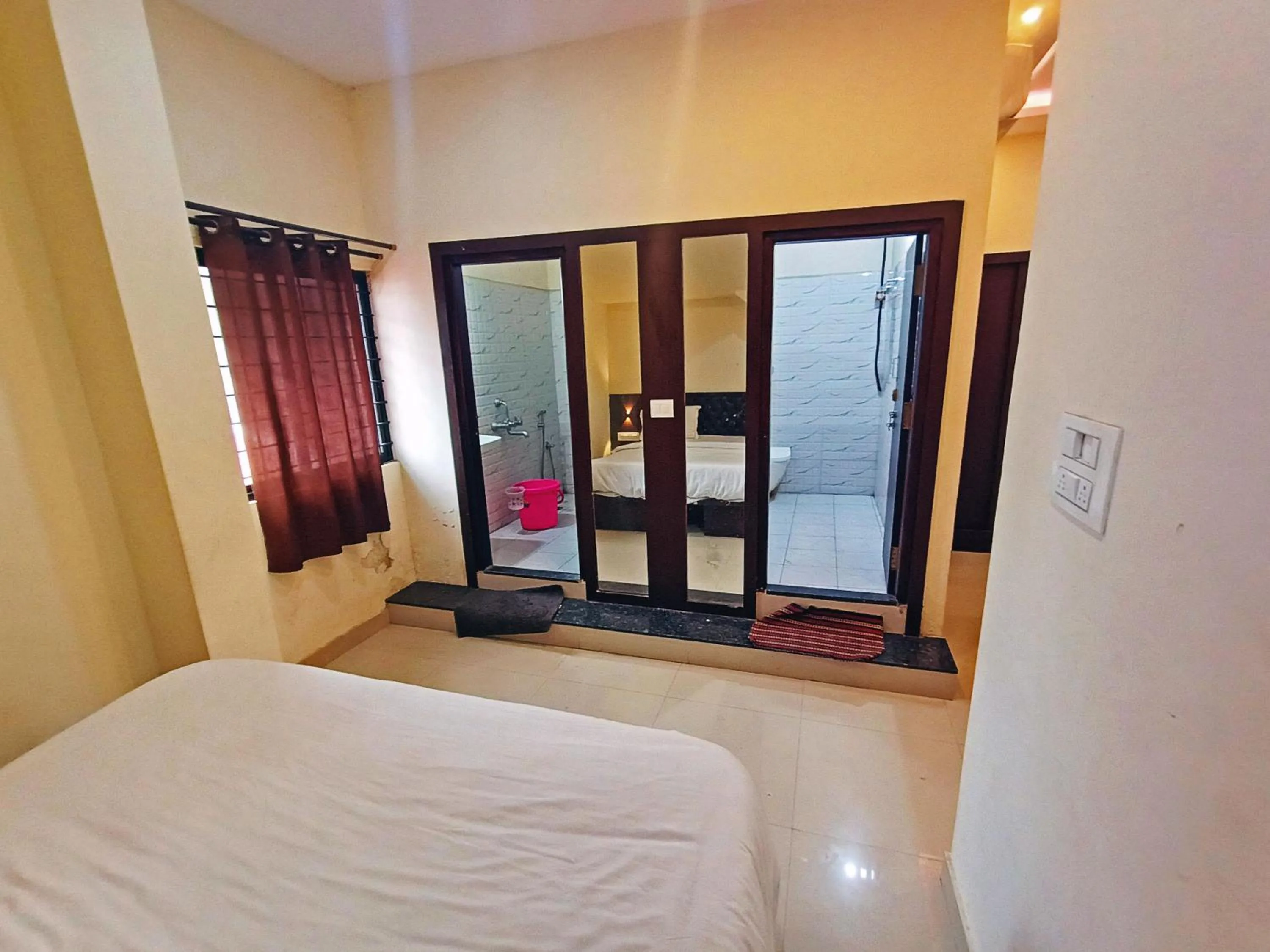 Bathroom, Bed in MG Residency